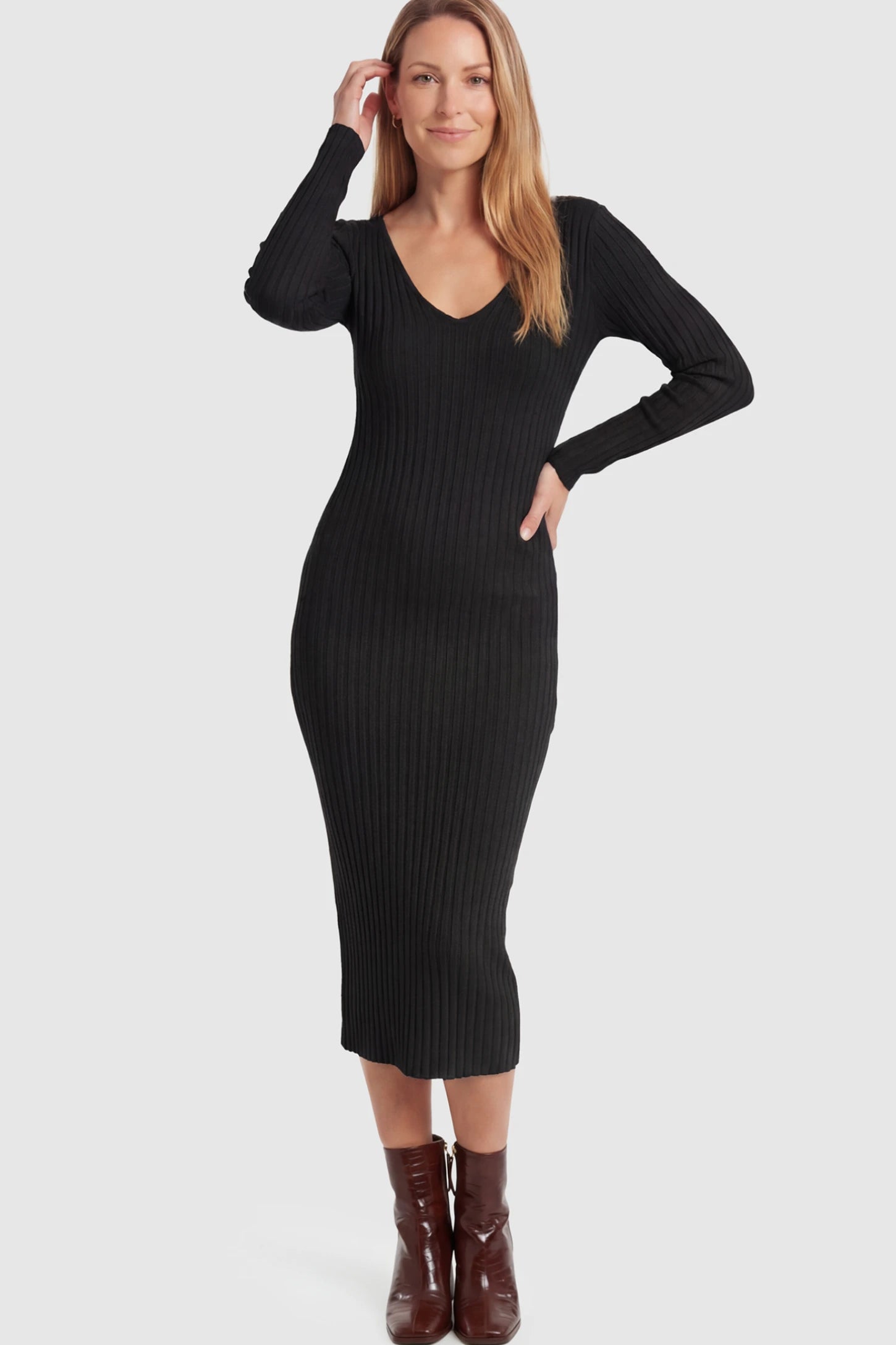 Ribbed V-Neck Long Sleeve Maternity Midi Dress Ribbed V-Neck Maternity Midi Dress in Black featuring a fitted long sleeve on a postpartum model.