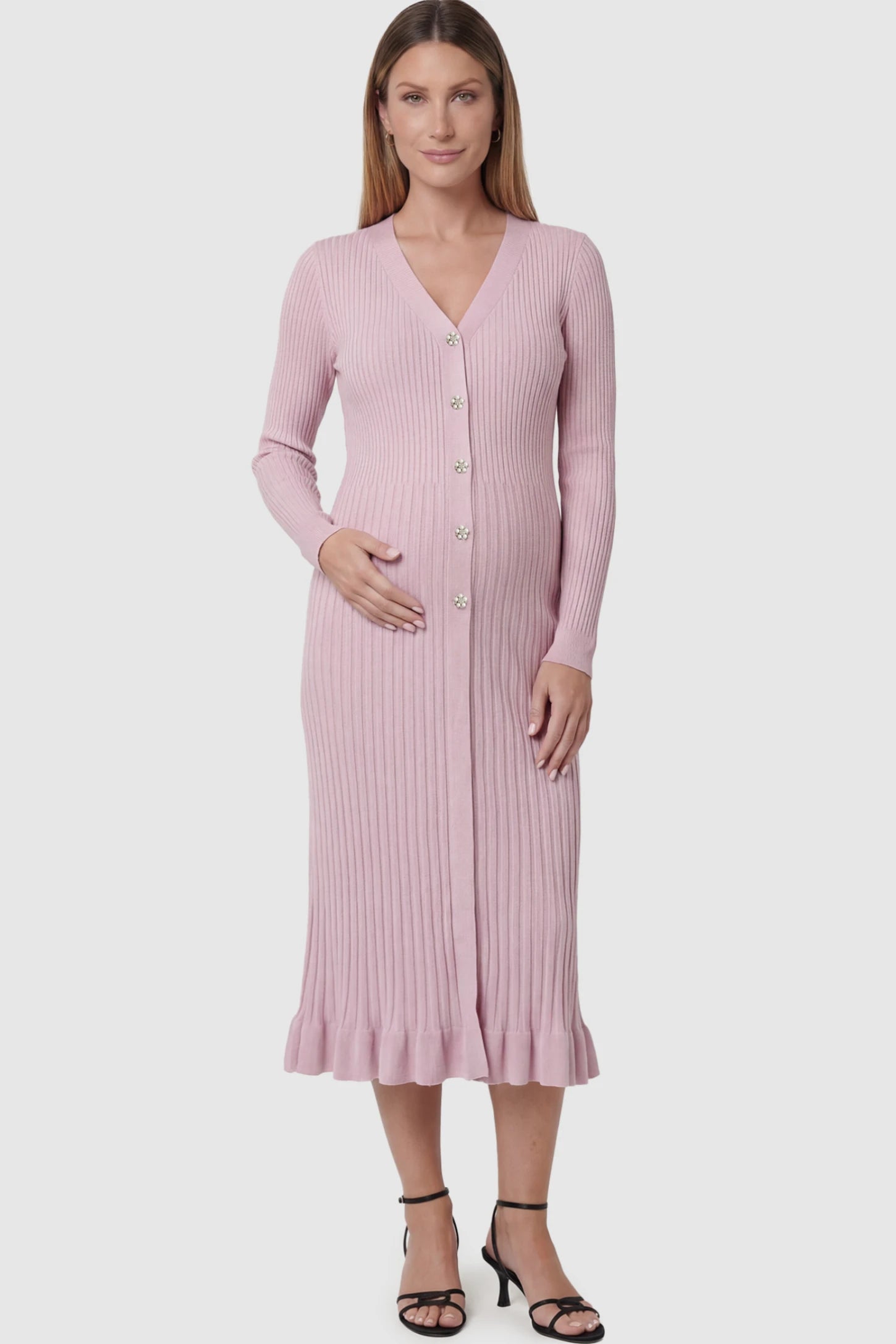Ribbed V-Neck Maternity Midi Sweater Dress in Pink featuring rhinestone buttons on a pregnant model showing front.