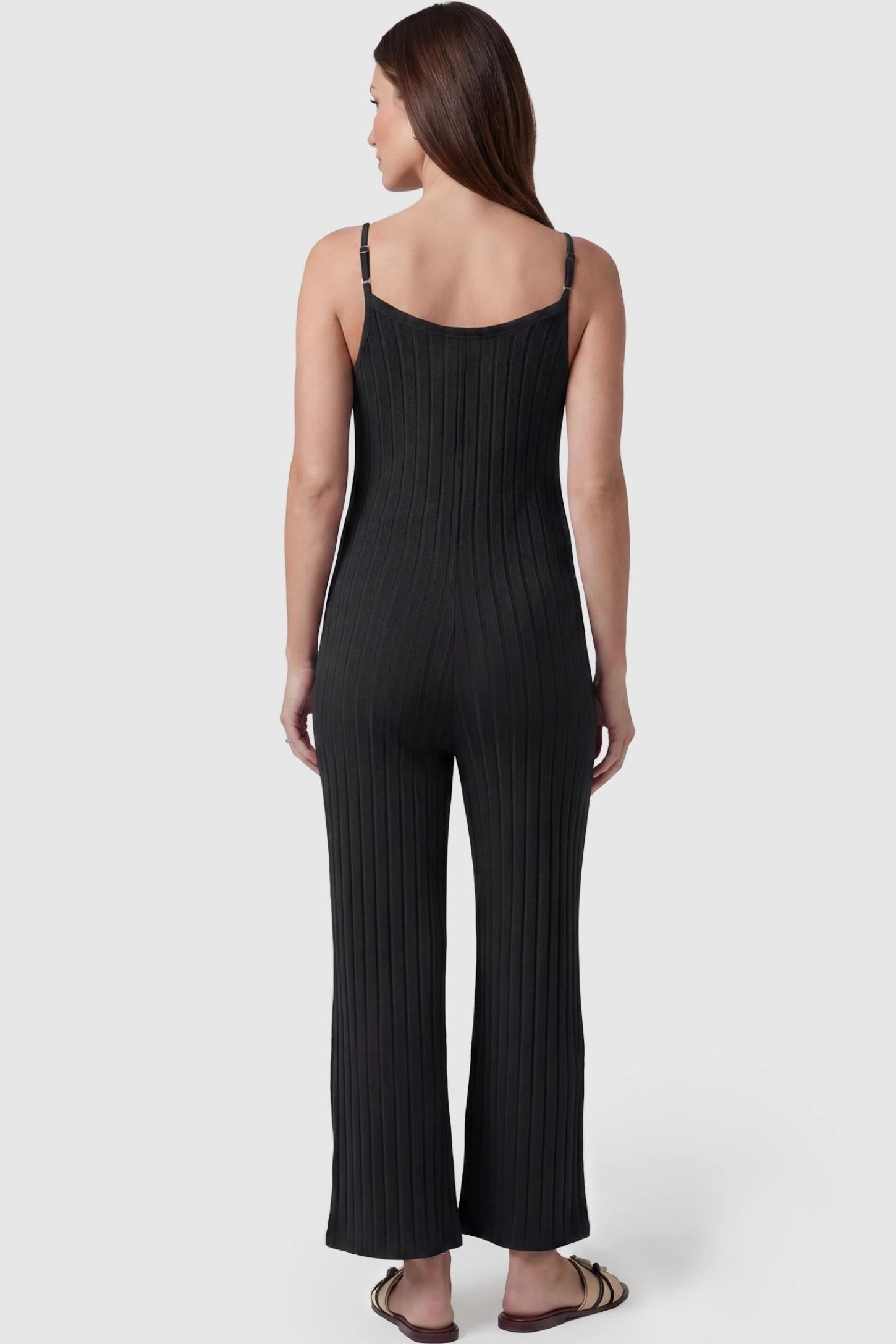 Ribbed Wide-Leg Maternity Camisole Jumpsuit Ribbed Wide-Leg Maternity Camisole Jumpsuit in Black featuring a high-stretch ribbed finish and wide-leg cut on a pregnant model, back view.