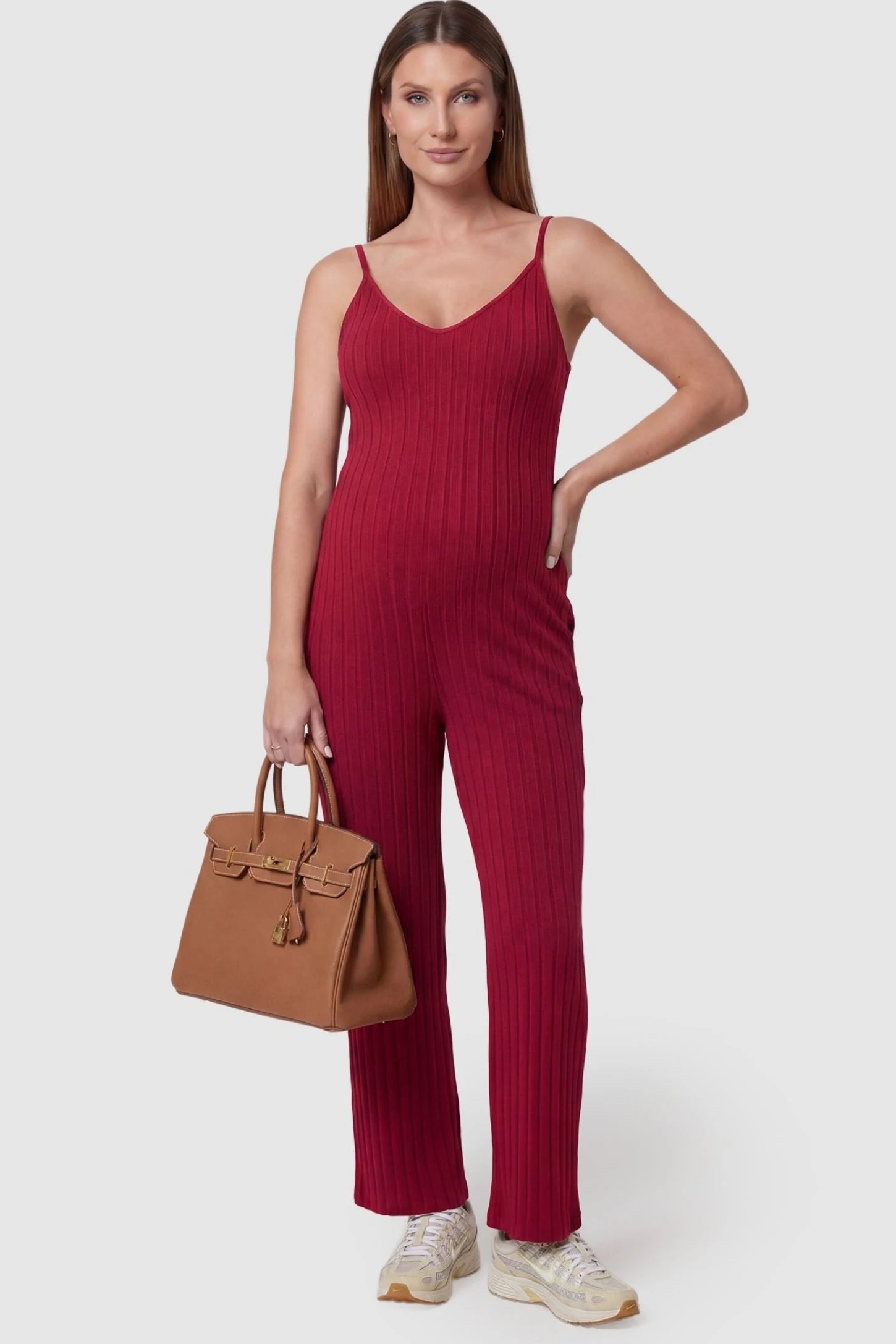 Ribbed Wide-Leg Maternity Camisole Jumpsuit in Red featuring a vertical ribbed texture and relaxed wide leg on a pregnant model, front view.