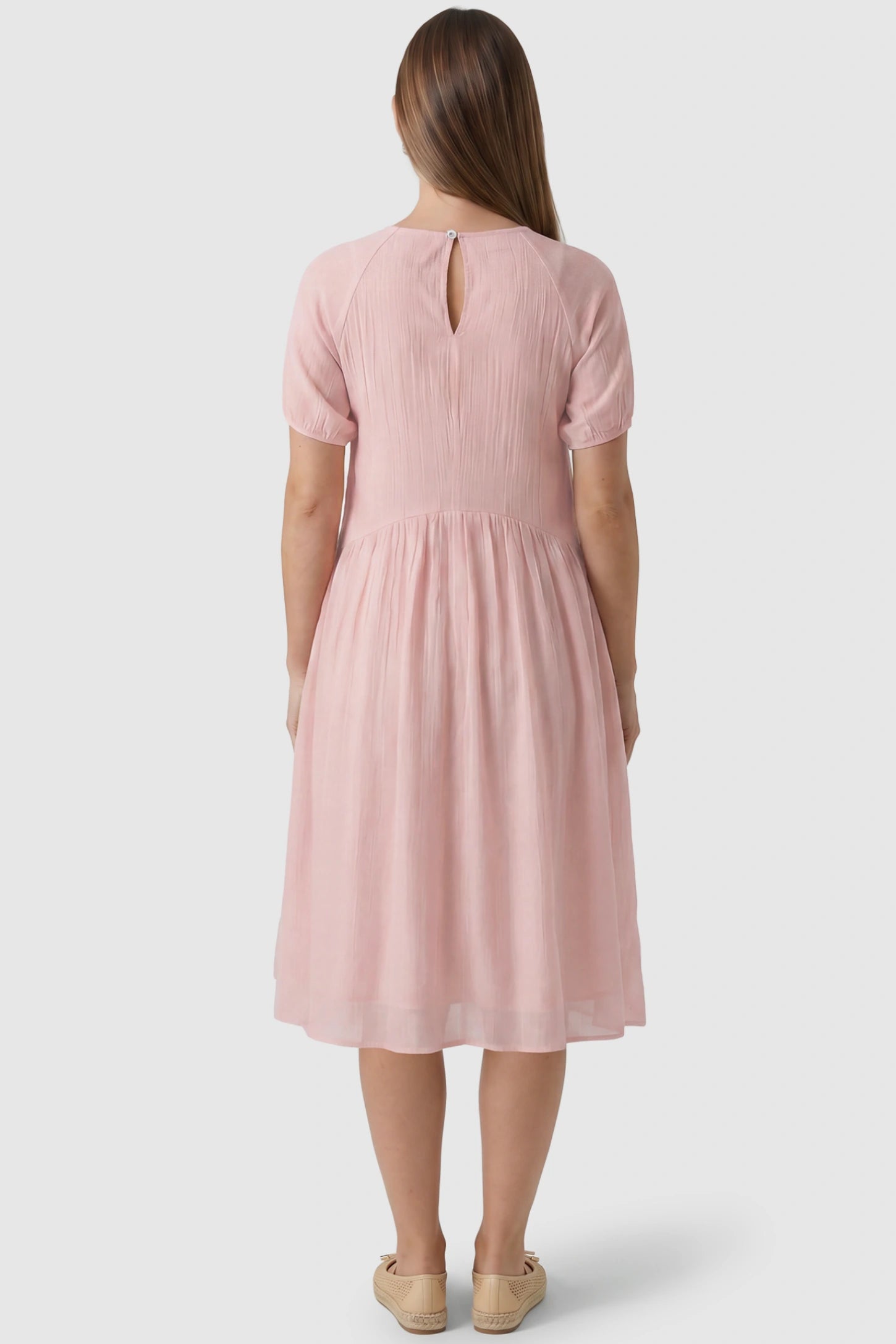 Round Neck Short Sleeve Flowy Maternity Midi Dress Round Neck Short Sleeve Flowy Maternity Midi Dress in Pink featuring keyhole opening on a pregnant model, back view.