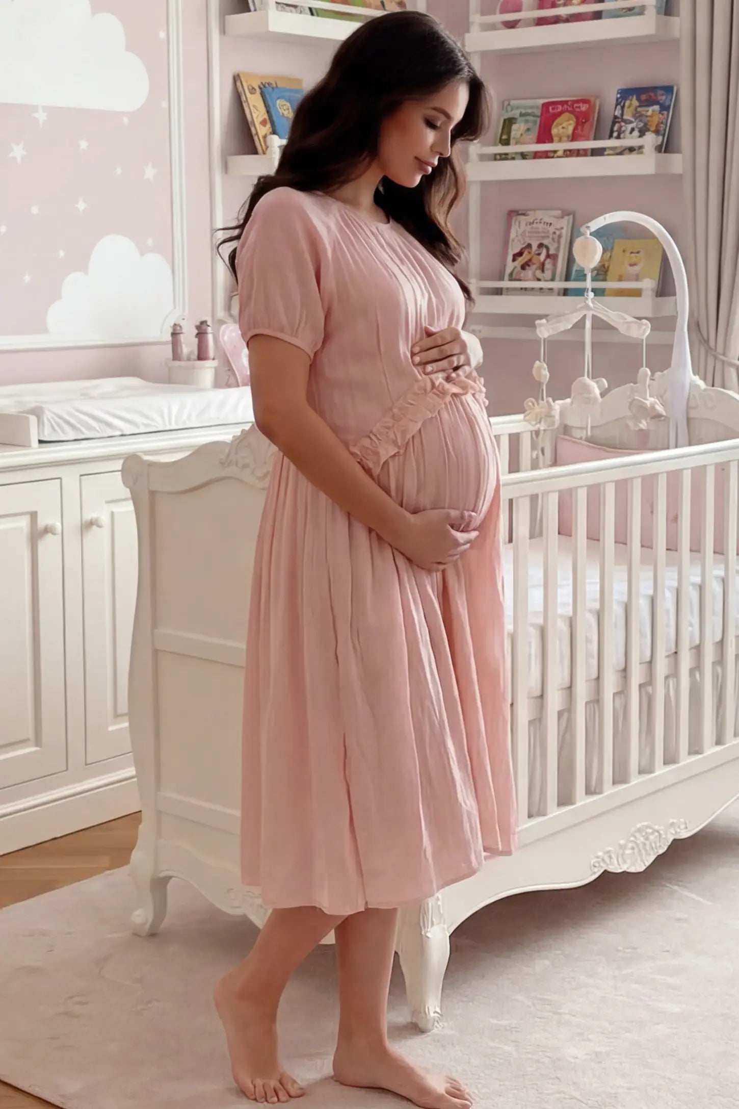 Round Neck Short Sleeve Flowy Maternity Midi Dress Round Neck Short Sleeve Flowy Maternity Midi Dress in Pink featuring ruffled waist on a pregnant woman in indoor setting, side view.