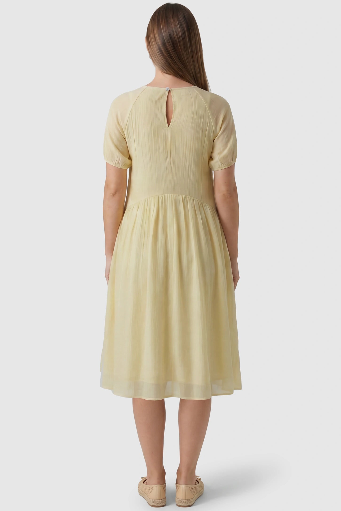 Round Neck Short Sleeve Flowy Maternity Midi Dress Round Neck Short Sleeve Flowy Maternity Midi Dress in Yellow featuring keyhole opening on a pregnant model, back view.