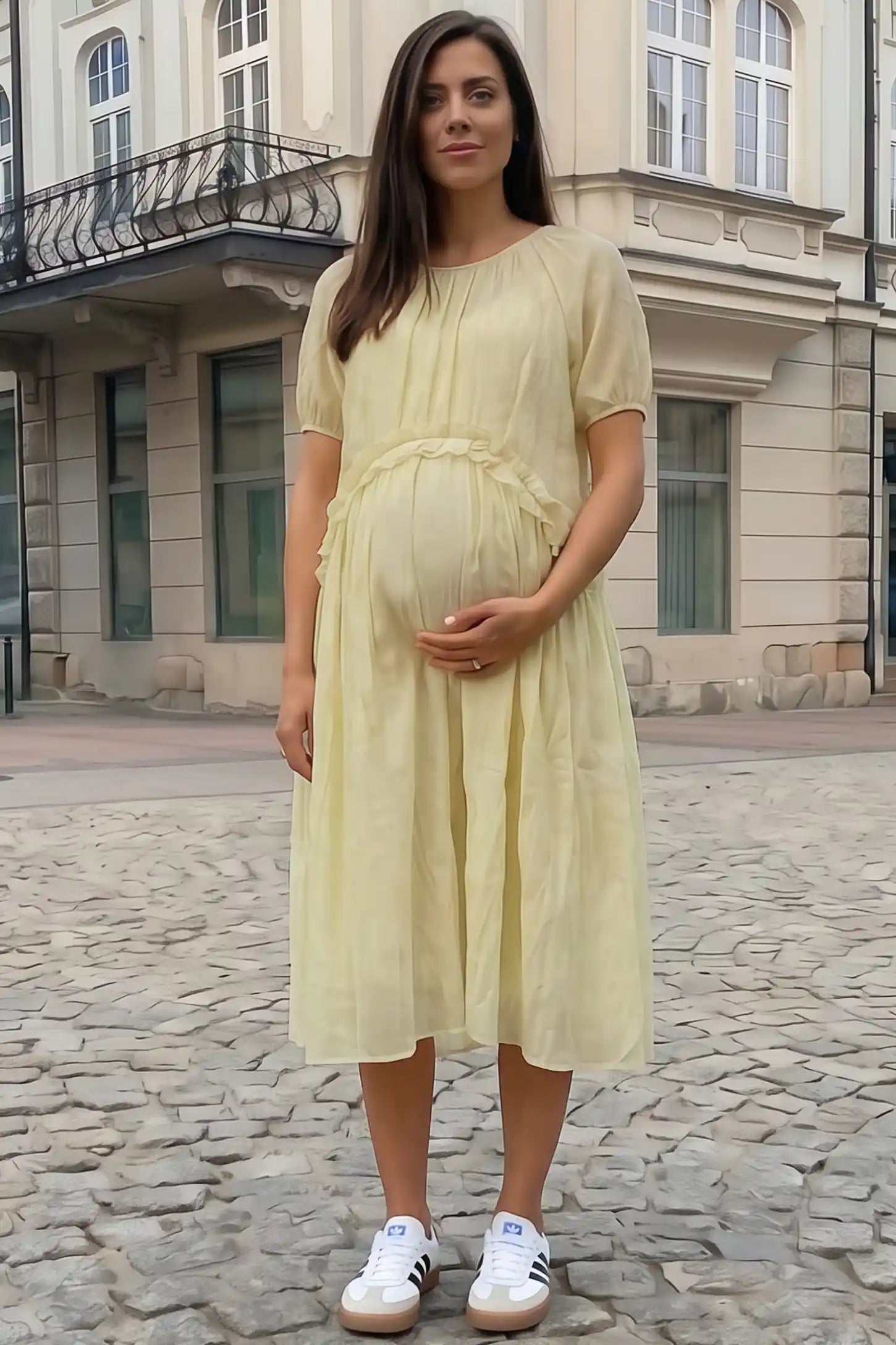 Round Neck Short Sleeve Flowy Maternity Midi Dress Round Neck Short Sleeve Flowy Maternity Midi Dress in Yellow featuring ruffled waist on a pregnant woman in outdoor setting, front view.