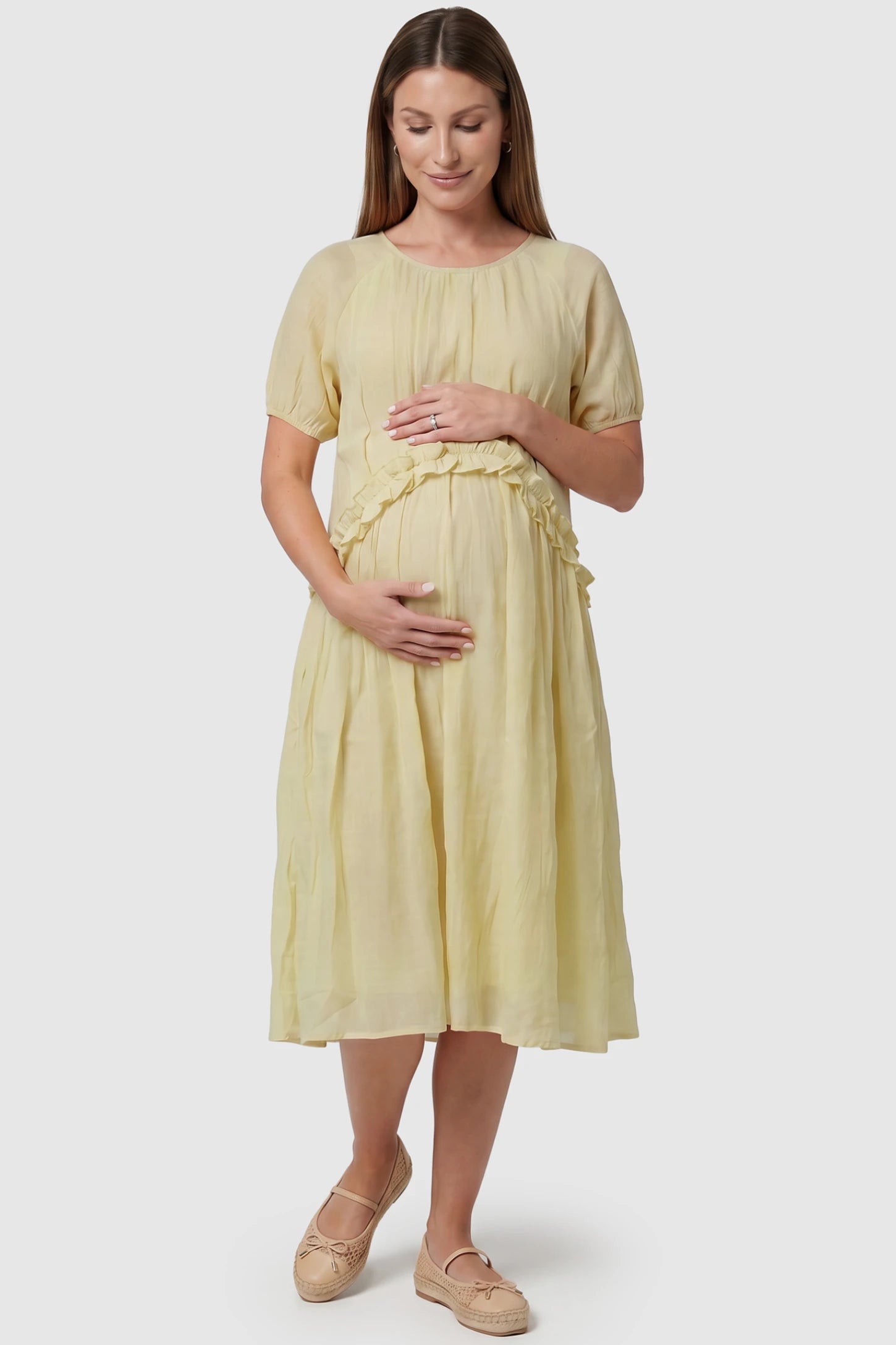 Round Neck Short Sleeve Flowy Maternity Midi Dress Round Neck Short Sleeve Flowy Maternity Midi Dress in Yellow featuring ruffled waist on a pregnant model, front view.