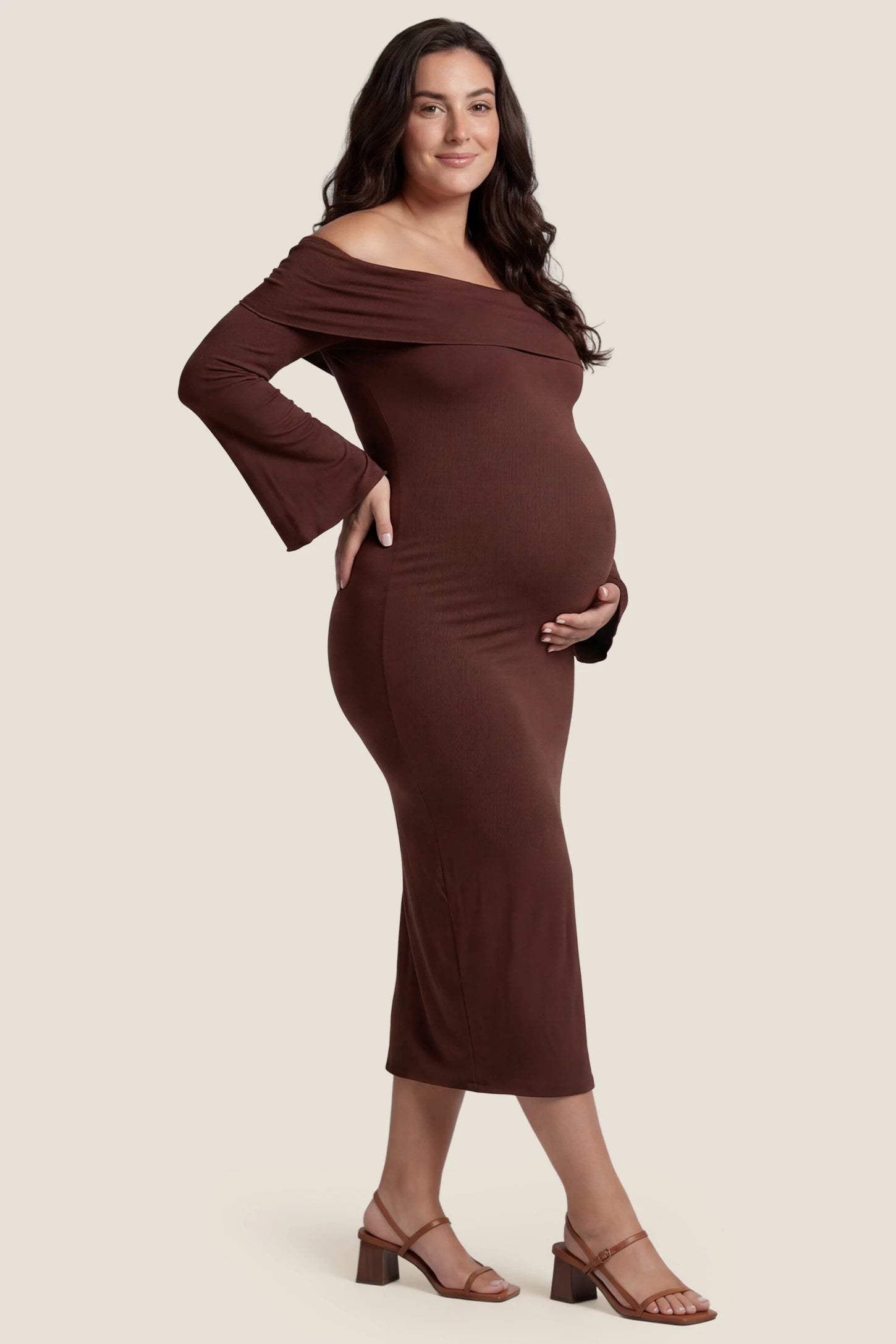 Ruched Off-shoulder Bodycon Maternity Midi Dress Ruched Off-shoulder Bodycon Maternity Midi Dress in Coffee with a form-fitting ruched silhouette, front view on a plus-size model.