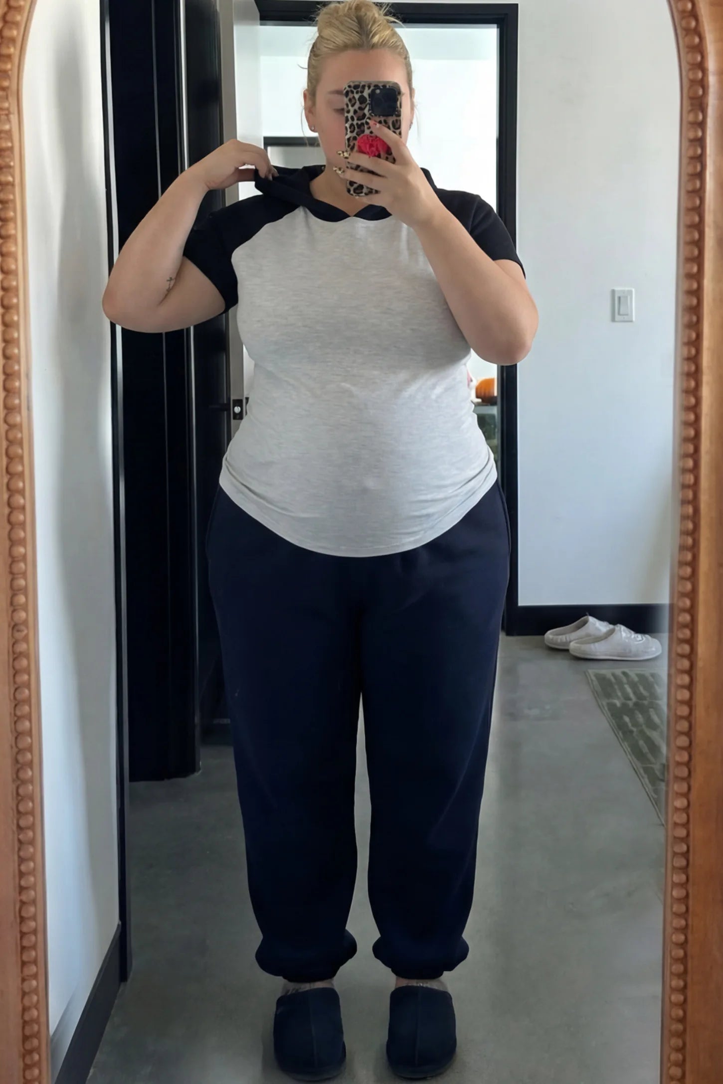 Ruched Raglan Short Sleeve Maternity T-Shirt Ruched Raglan Short Sleeve Maternity Top in Gray and Black featuring side-seam gathering on a pregnant woman.