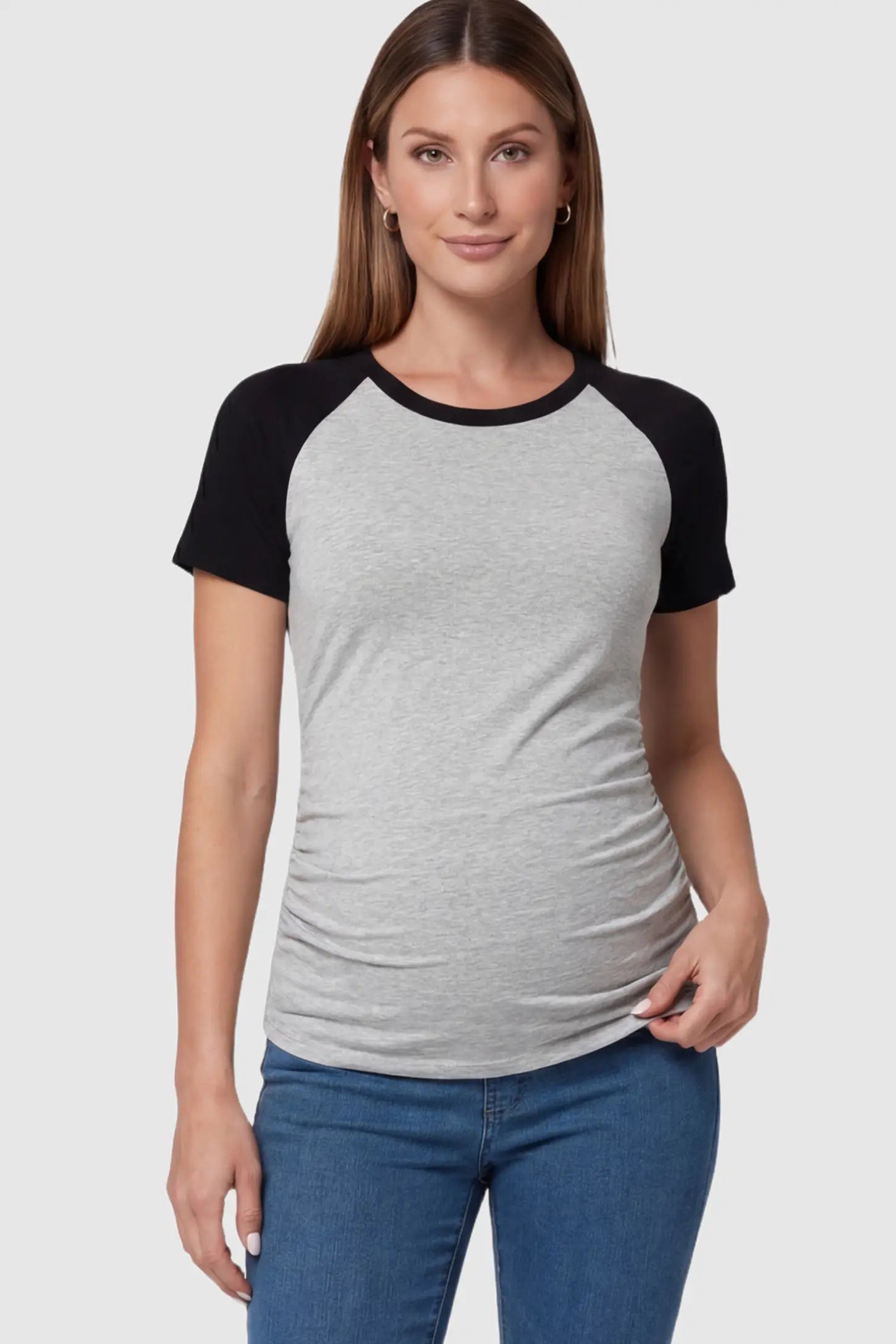 Ruched Raglan Short Sleeve Maternity T-Shirt Ruched Raglan Short Sleeve Maternity Top in Gray and Black featuring side-seam gathering on a pregnant model showing front.
