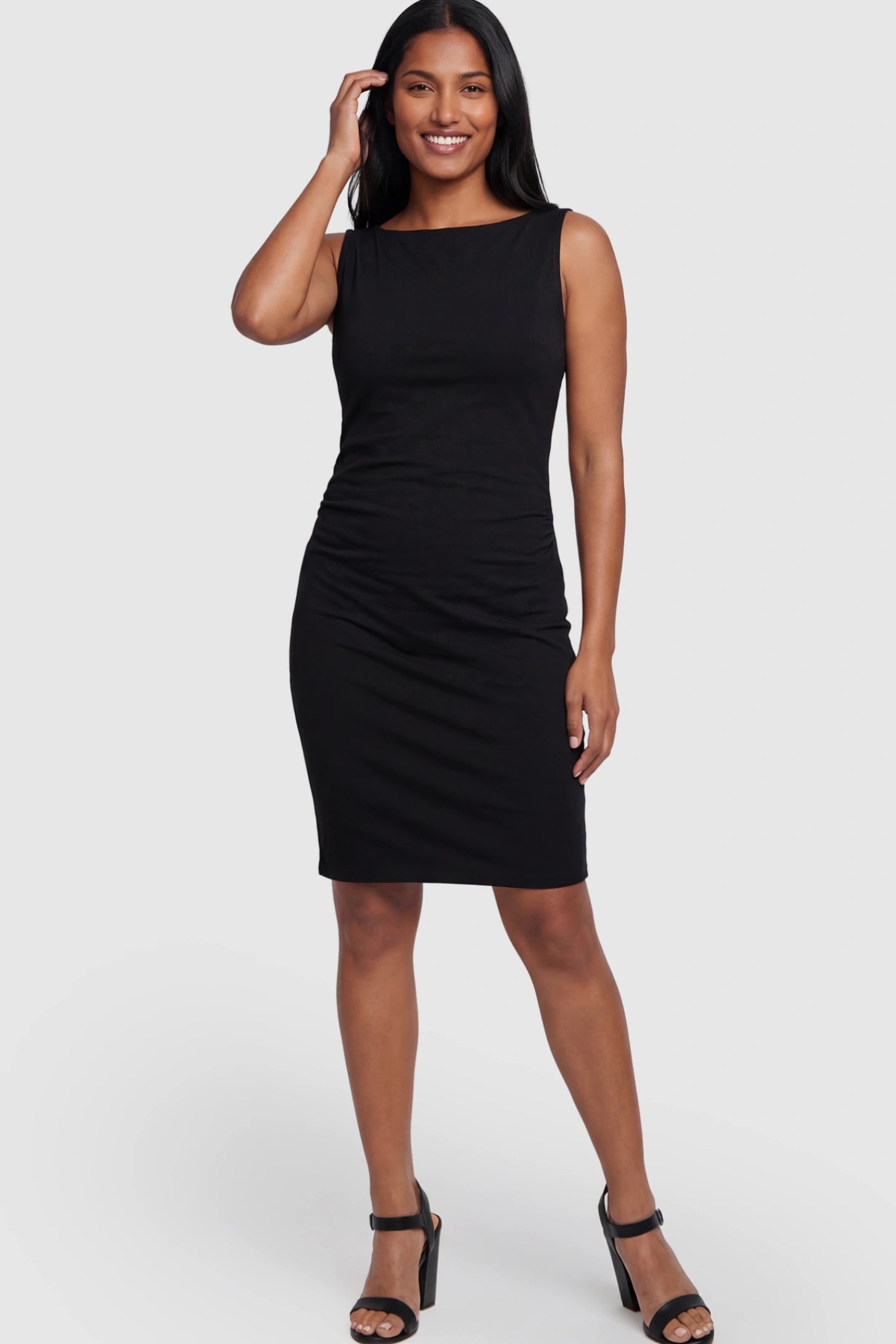 Ruched Sleeveless Bodycon Maternity Midi Dress Ruched Sleeveless Bodycon Maternity Midi Dress in Black featuring side-seam gathering on a postpartum model showing front.