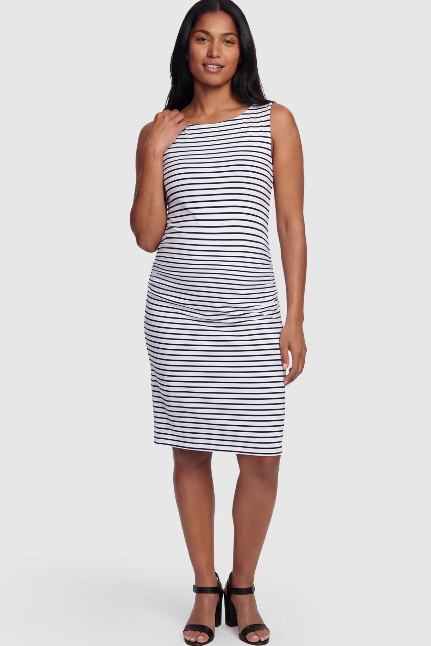 Ruched Sleeveless Bodycon Maternity Midi Dress Ruched Sleeveless Bodycon Maternity Midi Dress in Black white stripe pattern featuring side-seam gathering on a postpartum model showing front.