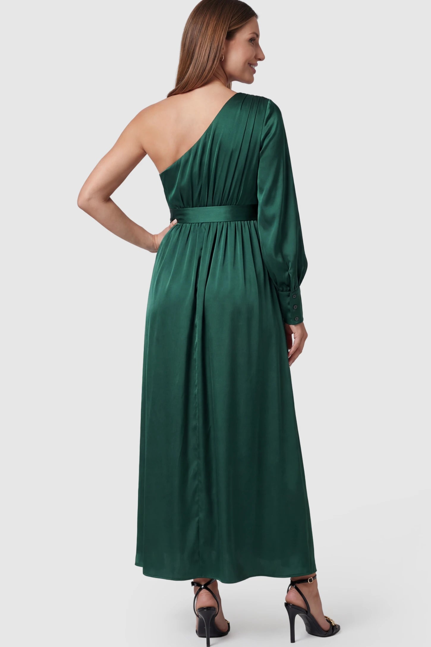 Satin One Shoulder Belted Maternity Maxi Dress Satin One-Shoulder Belted Maternity Maxi Dress in Green featuring a side slit and waist tie on a pregnant model showing back.