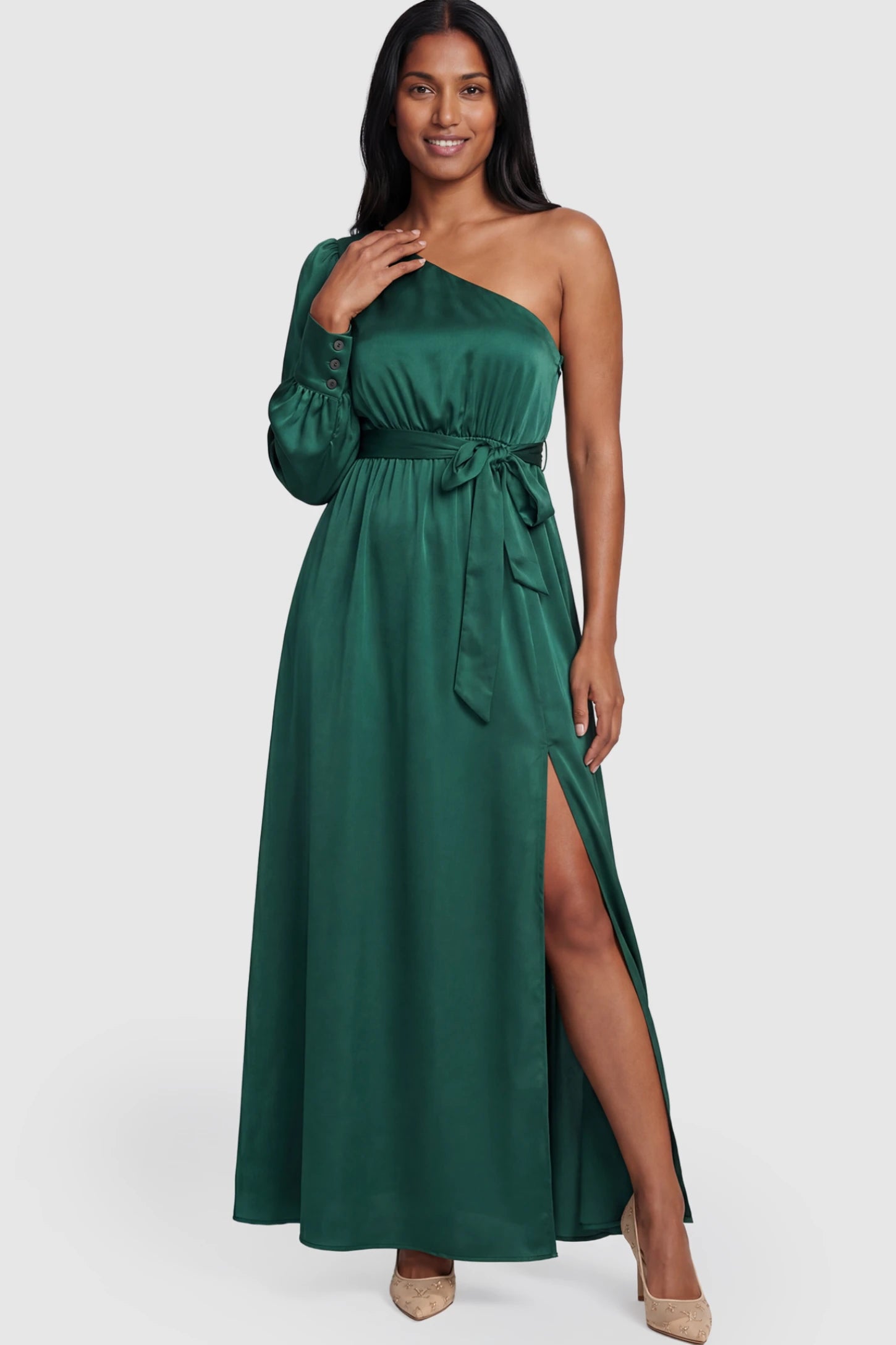 Satin One Shoulder Belted Maternity Maxi Dress Satin One-Shoulder Belted Maternity Maxi Dress in Green featuring a side slit and waist tie on a postpartum model.