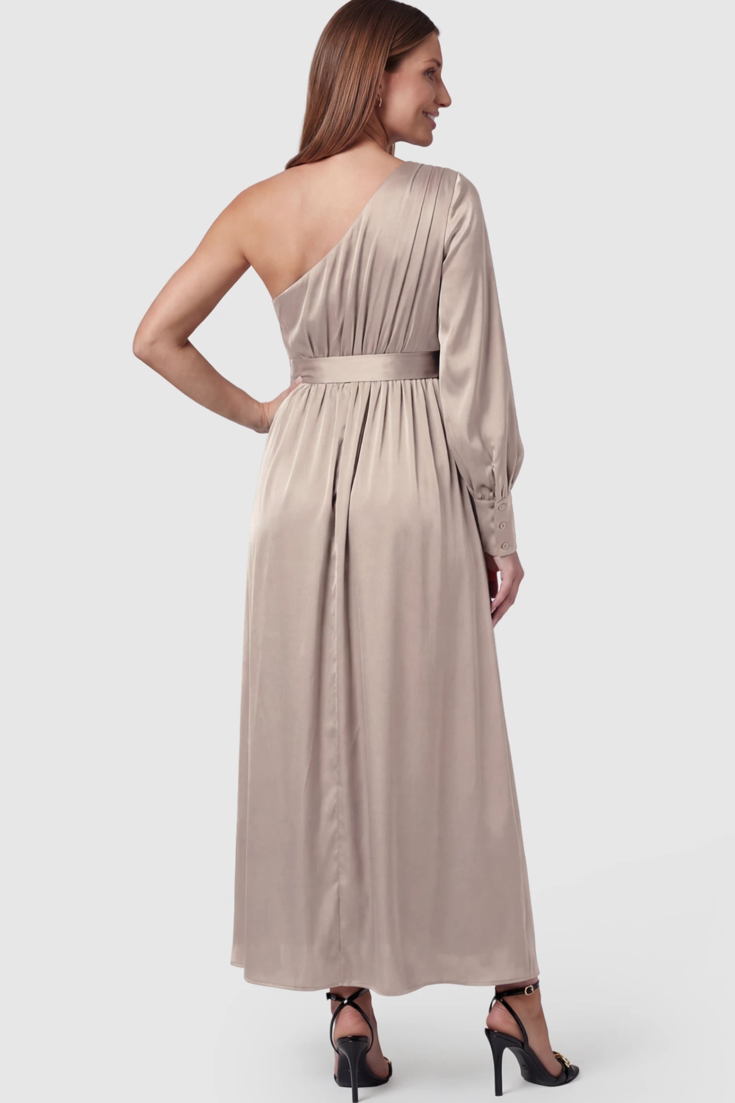 Satin One Shoulder Belted Maternity Maxi Dress Satin One-Shoulder Belted Maternity Maxi Dress in Light gray featuring a side slit and waist tie on a pregnant model showing back.