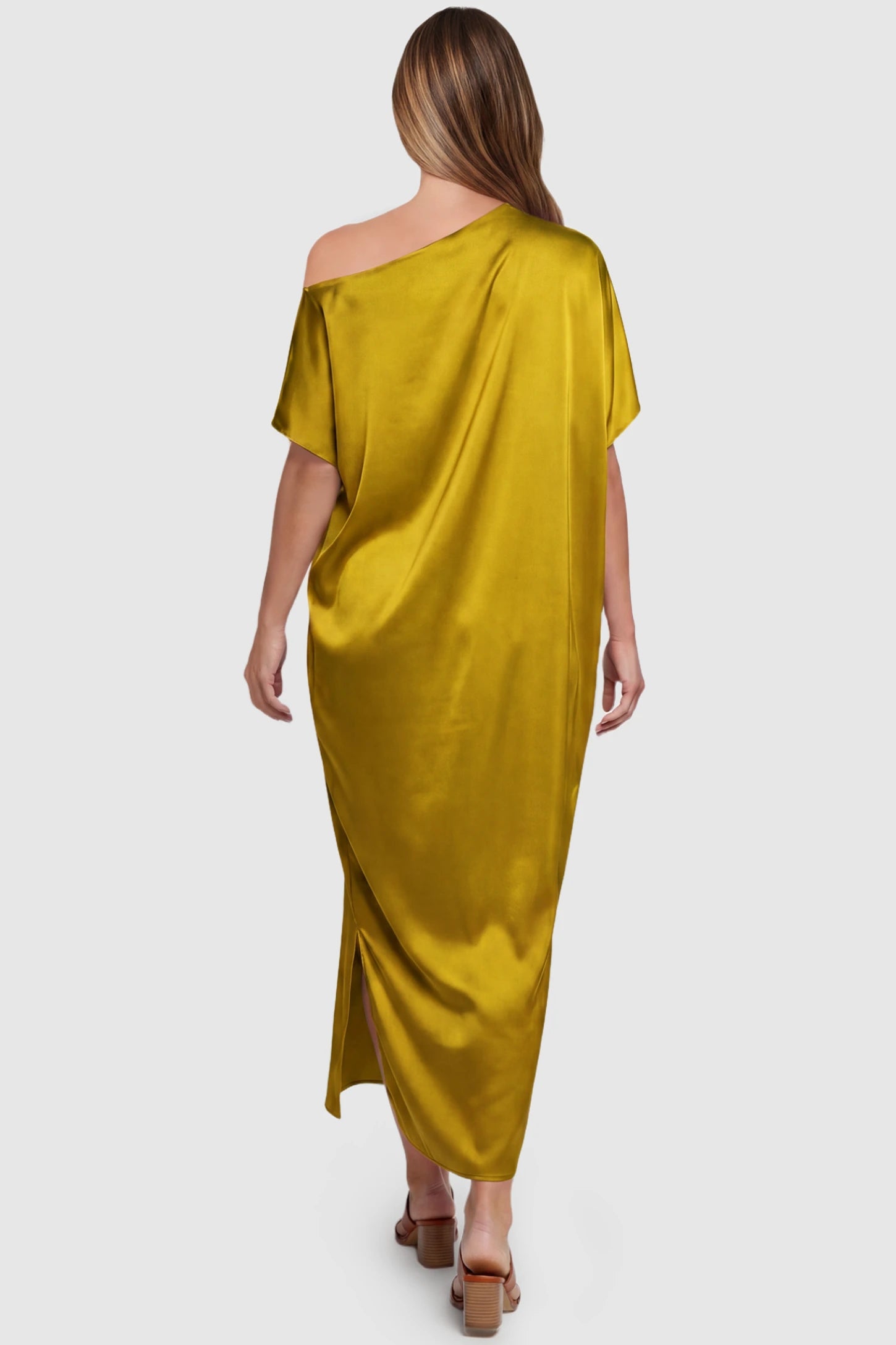 Satin One Shoulder Side Slit Maternity Maxi Dress Satin One Shoulder Side Slit Maternity Maxi Dress in Yellow featuring a draped batwing sleeve on a pregnant model, back view.