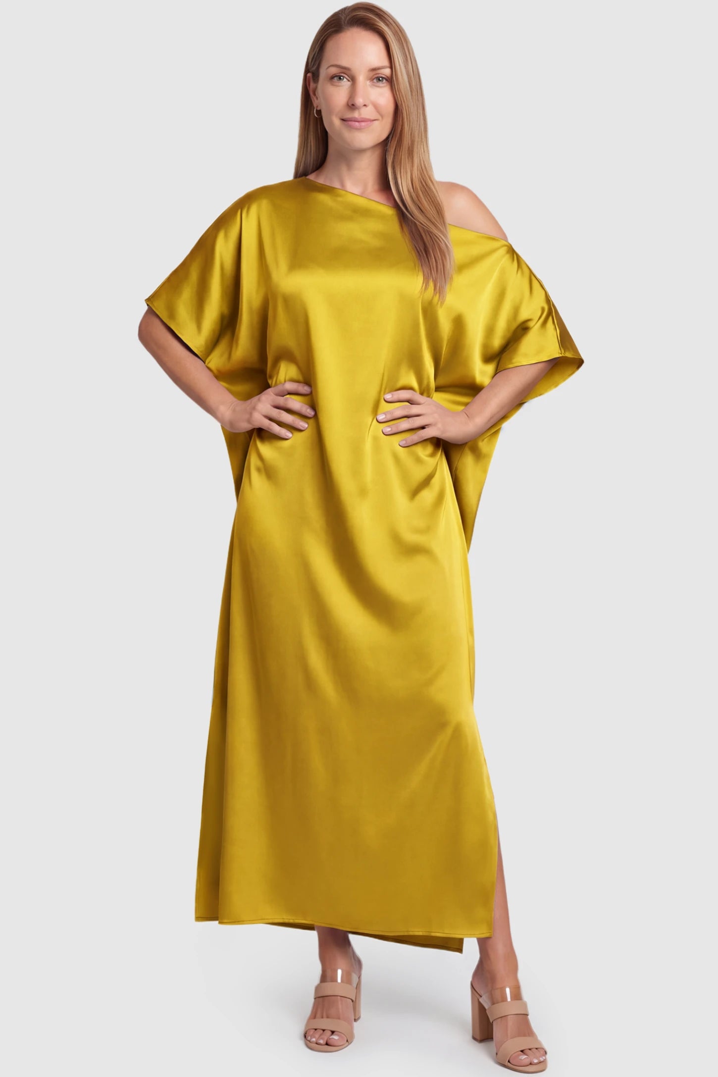 Satin One Shoulder Side Slit Maternity Maxi Dress Satin One Shoulder Side Slit Maternity Maxi Dress in Yellow featuring a draped batwing sleeve on a postpartum model, front view.