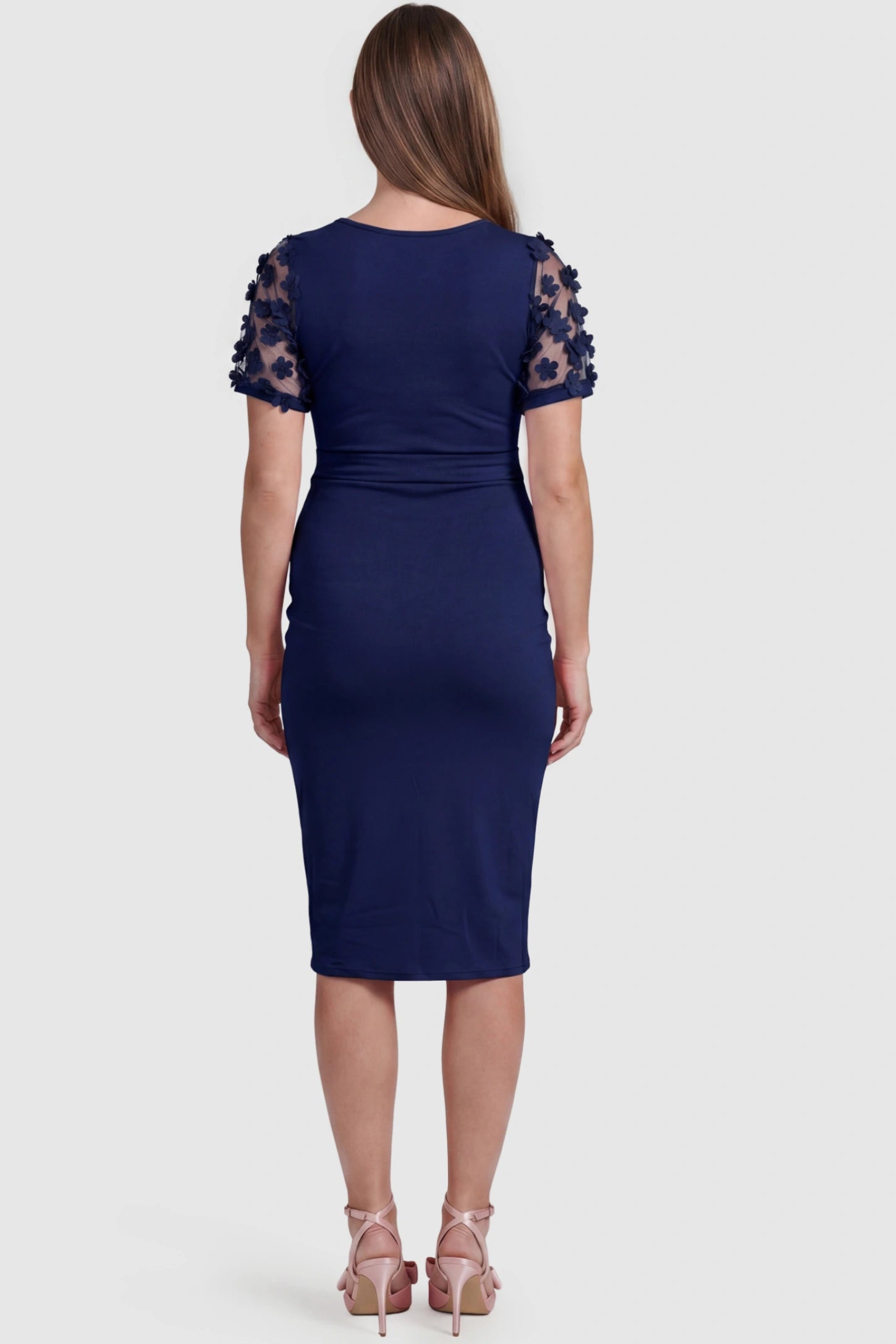 Side Ruched Round Neck Short Sleeve Maternity Short Dress Side Ruched Round Neck Short Sleeve Maternity Short Dress in dark blue featuring floral-detailed sleeves on a pregnant model, back view.