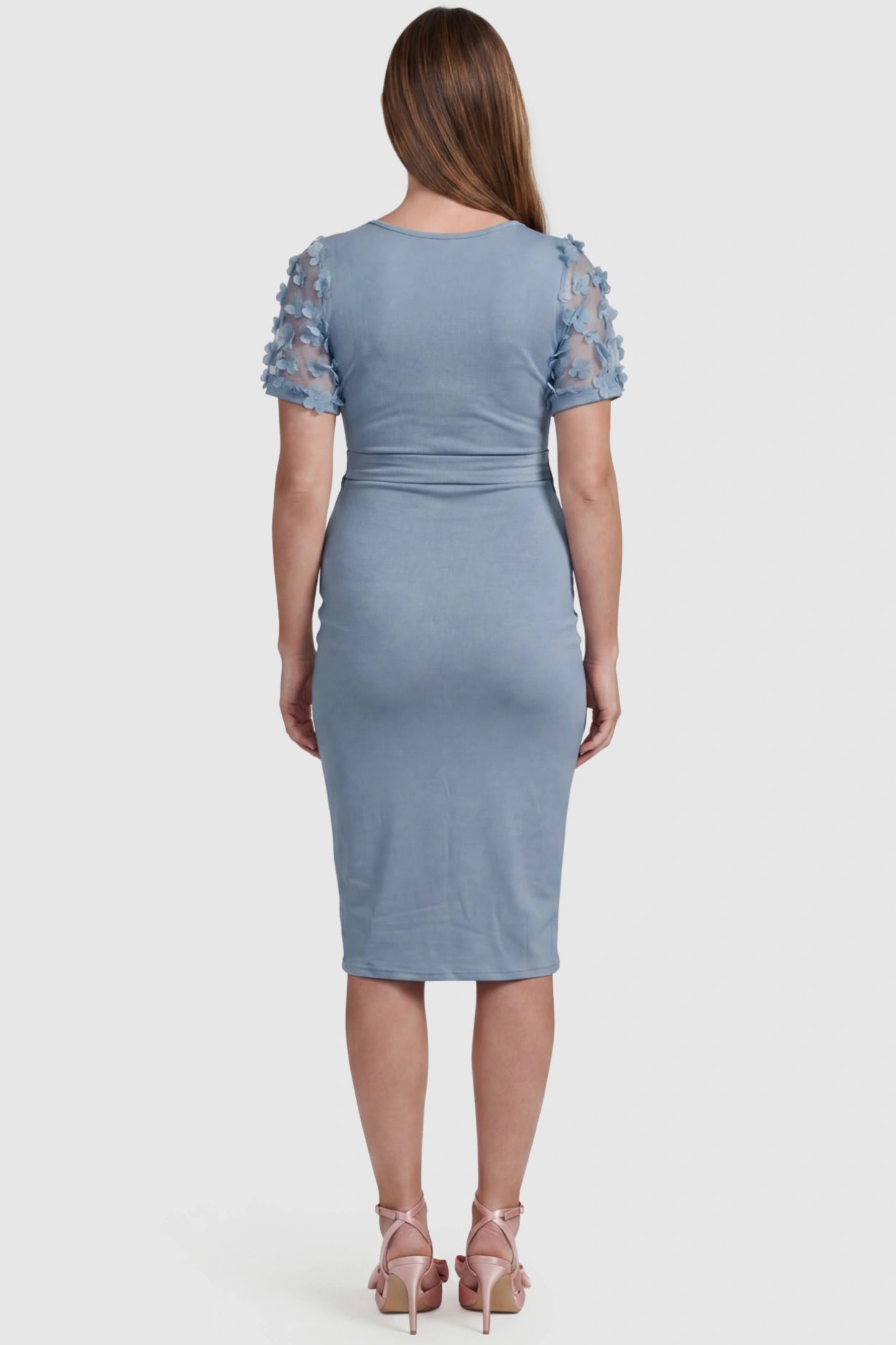 Side Ruched Round Neck Short Sleeve Maternity Short Dress Side Ruched Round Neck Short Sleeve Maternity Short Dress in light blue featuring floral-detailed sleeves on a pregnant model, back view.