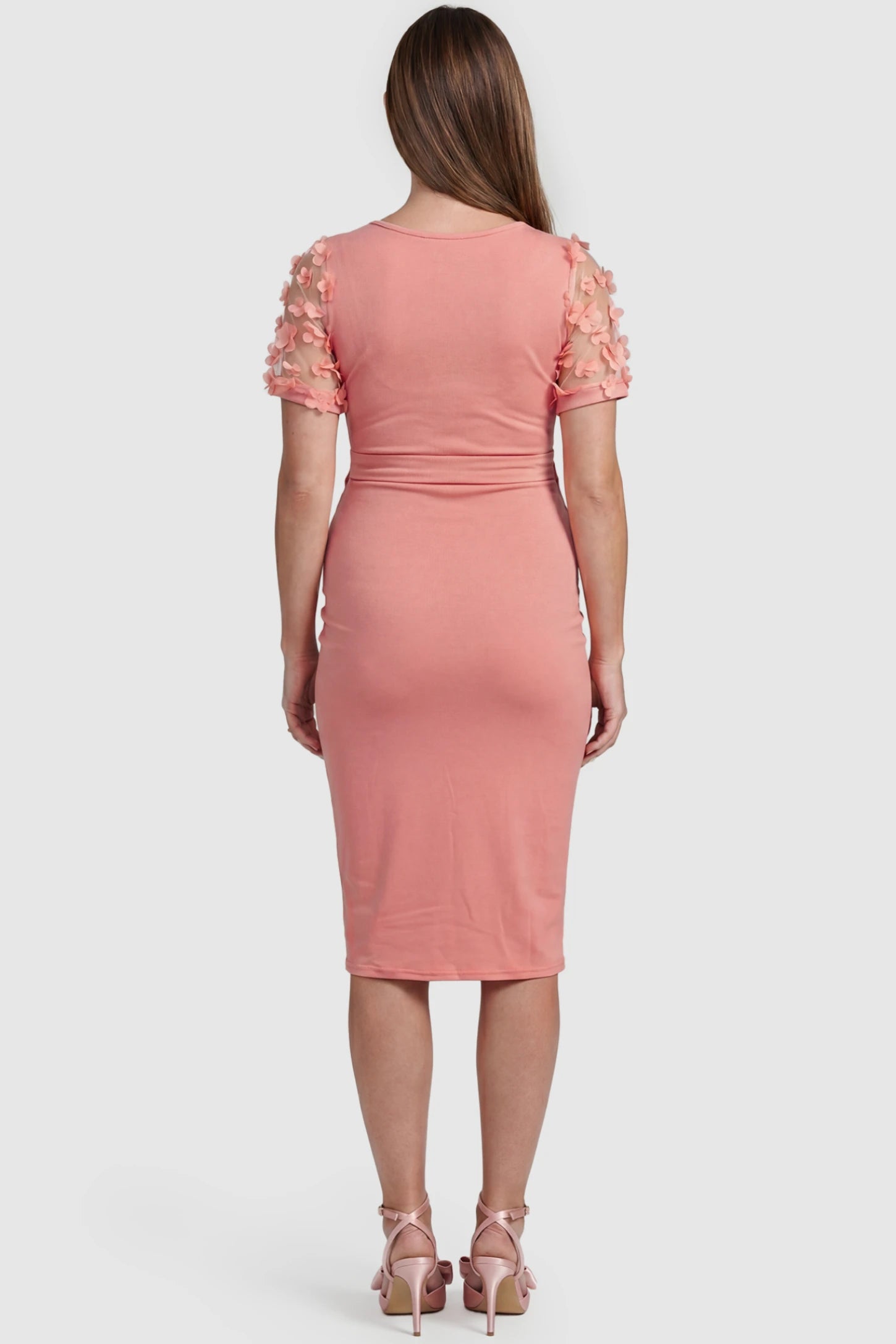 Side Ruched Round Neck Short Sleeve Maternity Short Dress Side Ruched Round Neck Short Sleeve Maternity Short Dress in pink featuring floral-detailed sleeves on a pregnant model, back view.