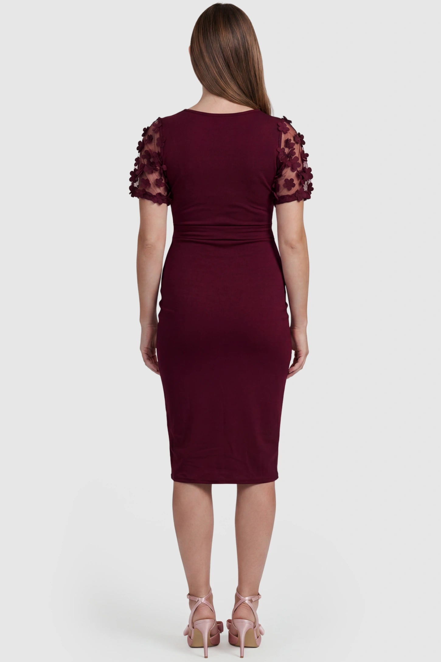 Side Ruched Round Neck Short Sleeve Maternity Short Dress Side Ruched Round Neck Short Sleeve Maternity Short Dress in wine red featuring floral-detailed sleeves on a pregnant model, back view.