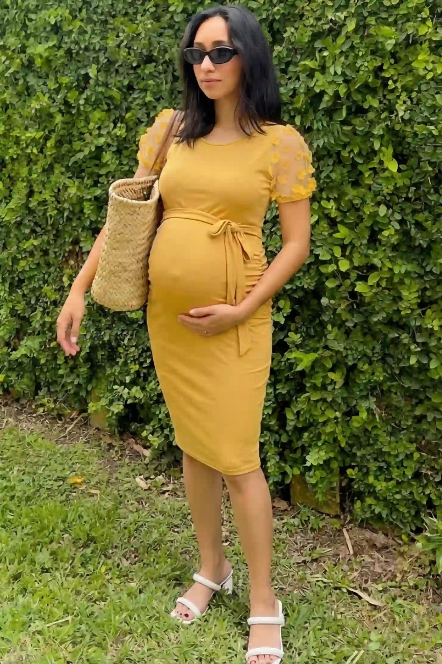 Side Ruched Round Neck Short Sleeve Maternity Short Dress Side Ruched Round Neck Short Sleeve Maternity Short Dress in yellow featuring floral-detailed sleeves on a pregnant woman in outdoor setting, front view.