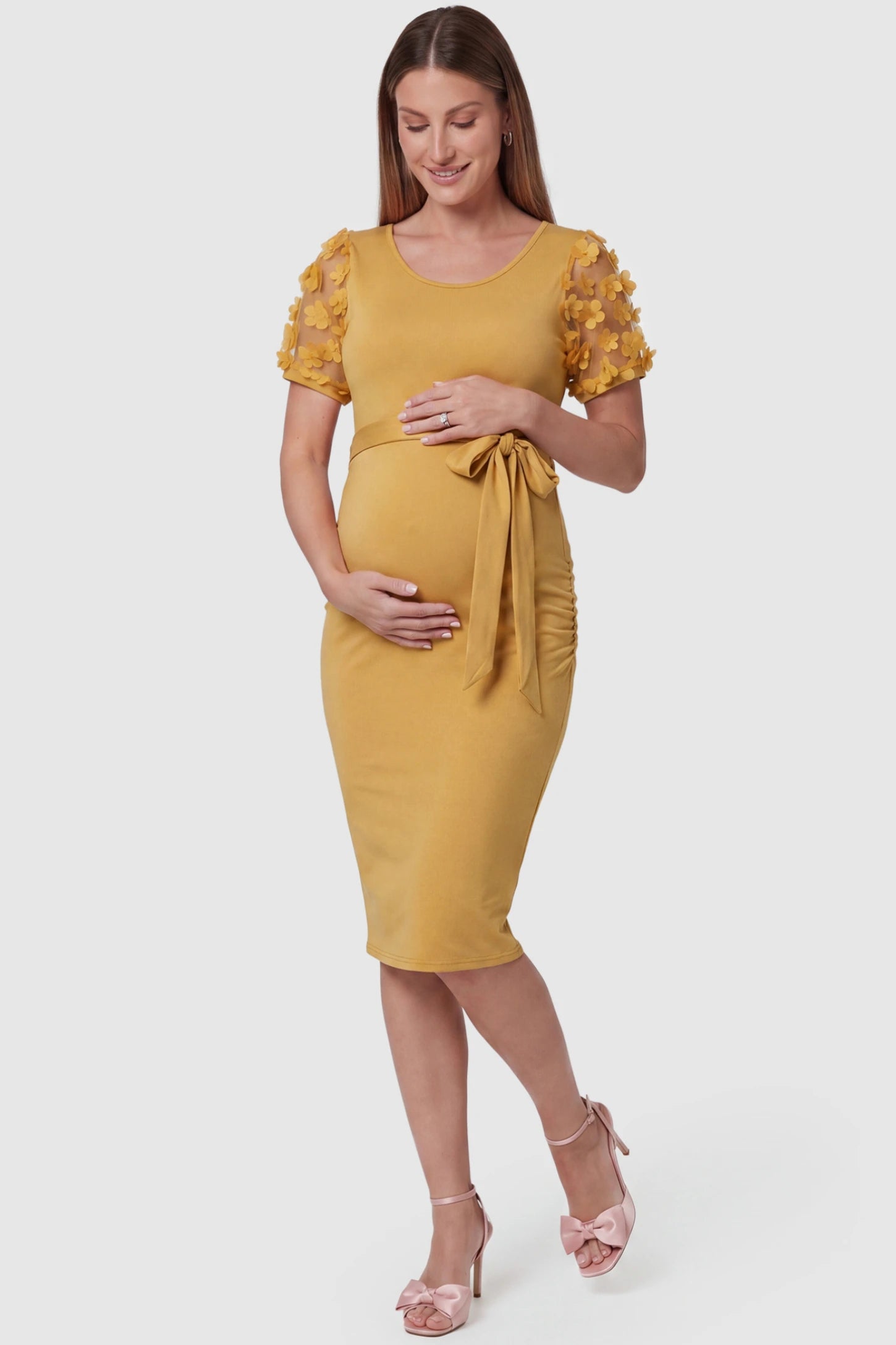 Side Ruched Round Neck Short Sleeve Maternity Short Dress Side Ruched Round Neck Short Sleeve Maternity Short Dress in yellow featuring floral-detailed sleeves on a pregnant model, front view.