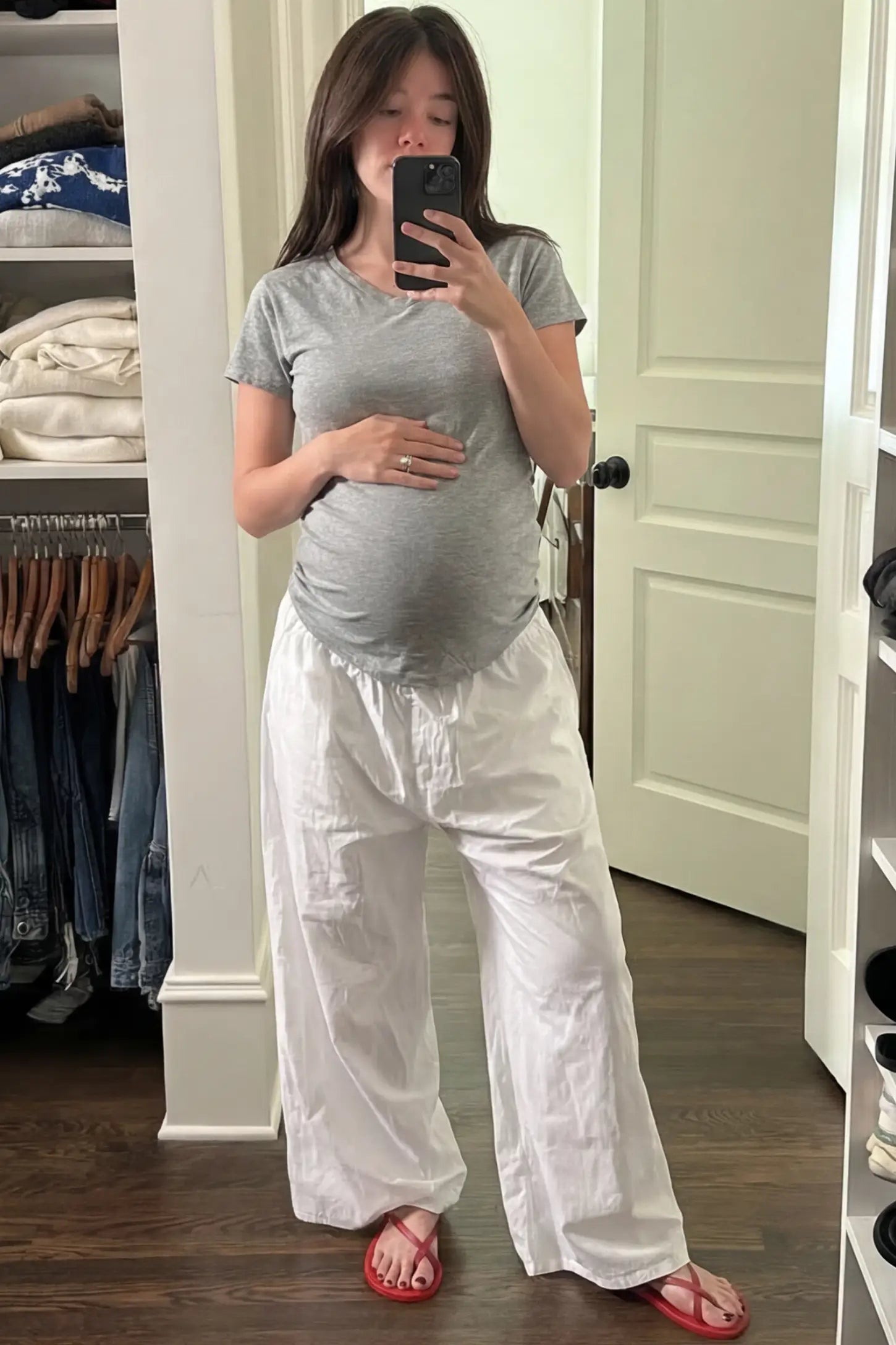 Side Ruched V-Neck Short Sleeve Maternity T-Shirt Side Ruched V-Neck Short Sleeve Maternity T-Shirt in Gray featuring breathable fabric and ruching on sides on a pregnant woman in indoor setting, front view.