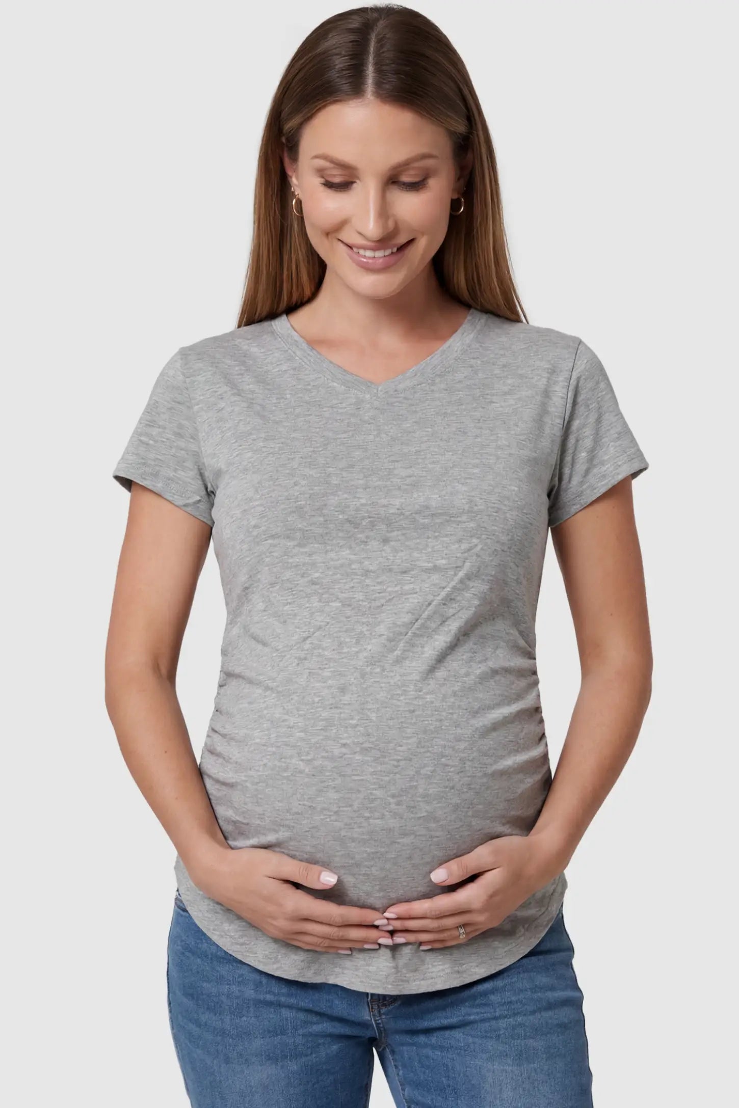 Side Ruched V-Neck Short Sleeve Maternity T-Shirt Side Ruched V-Neck Short Sleeve Maternity T-Shirt in Gray featuring breathable fabric and ruching on sides on a pregnant model, front view.