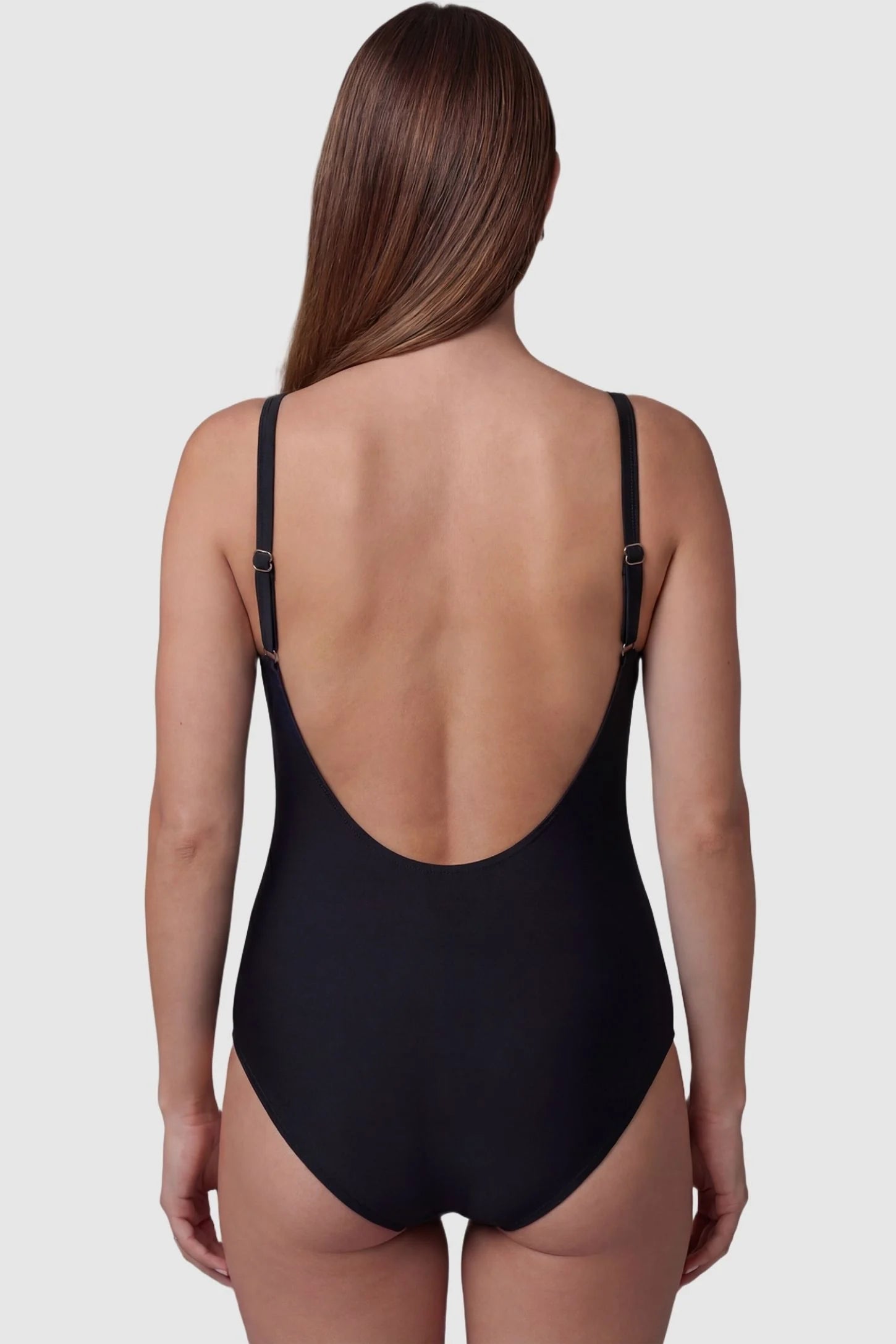 Side-Ruched Wrap-Front Maternity Swimsuit Side-Ruched Wrap-Front Maternity Swimsuit in Black with adjustable straps on a pregnant model, back view.
