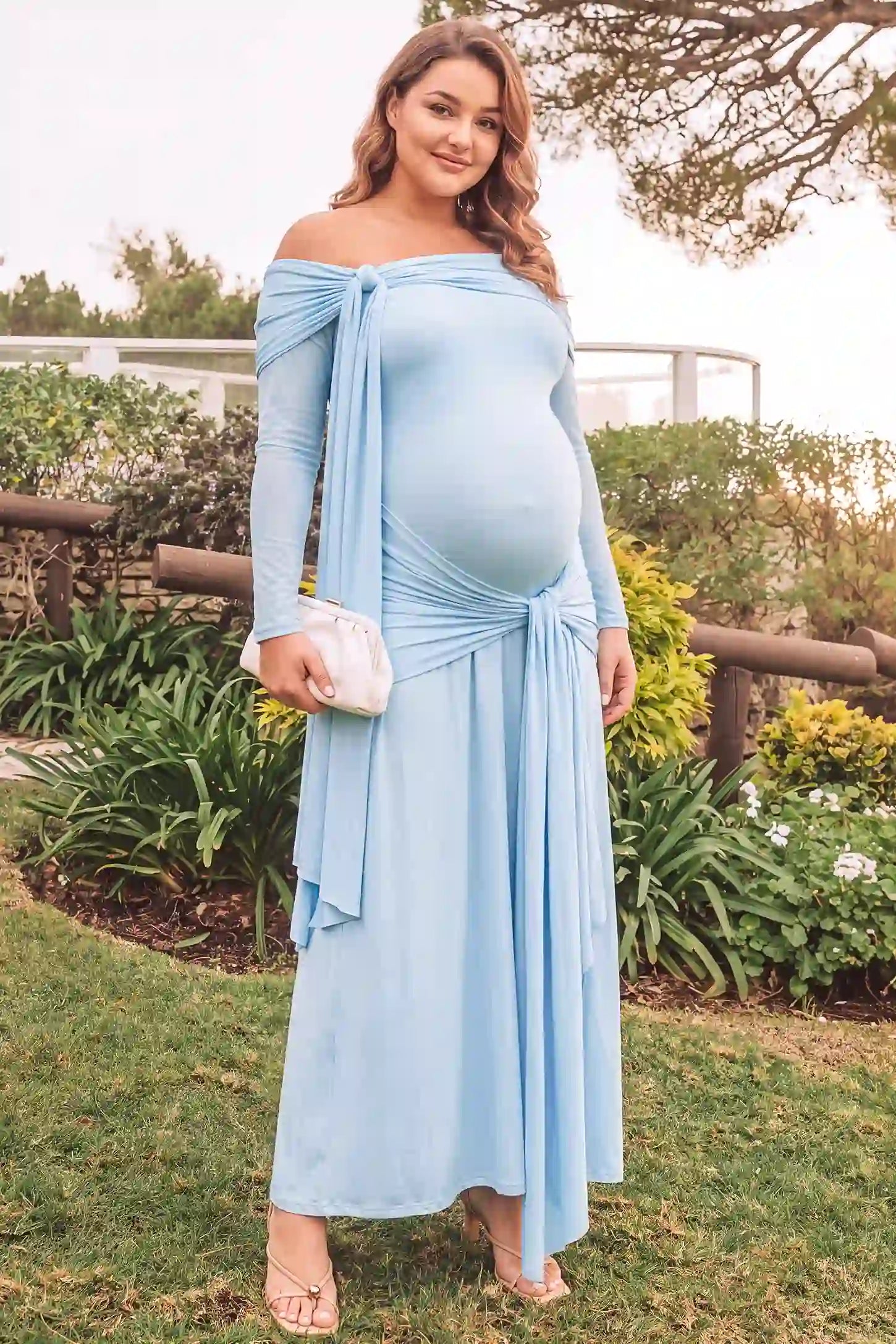 Side Tie Off-Shoulder Maxi Maternity Gown Side Tie Off-Shoulder Maxi Maternity Gown in Light Blue with elegant neckline, front view on a plus-size model.