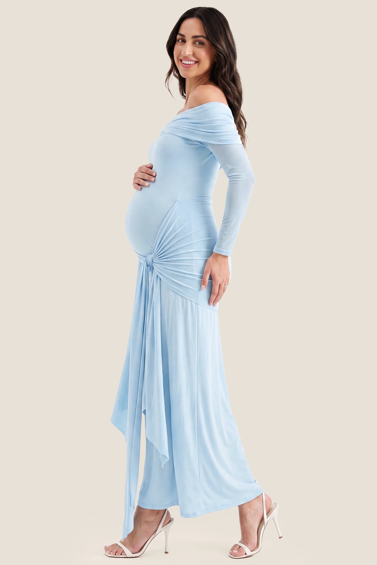 Side Tie Off-Shoulder Maxi Maternity Gown Side Tie Off-Shoulder Maxi Maternity Gown in Light Blue with flattering drape, side view on a pregnant model.
