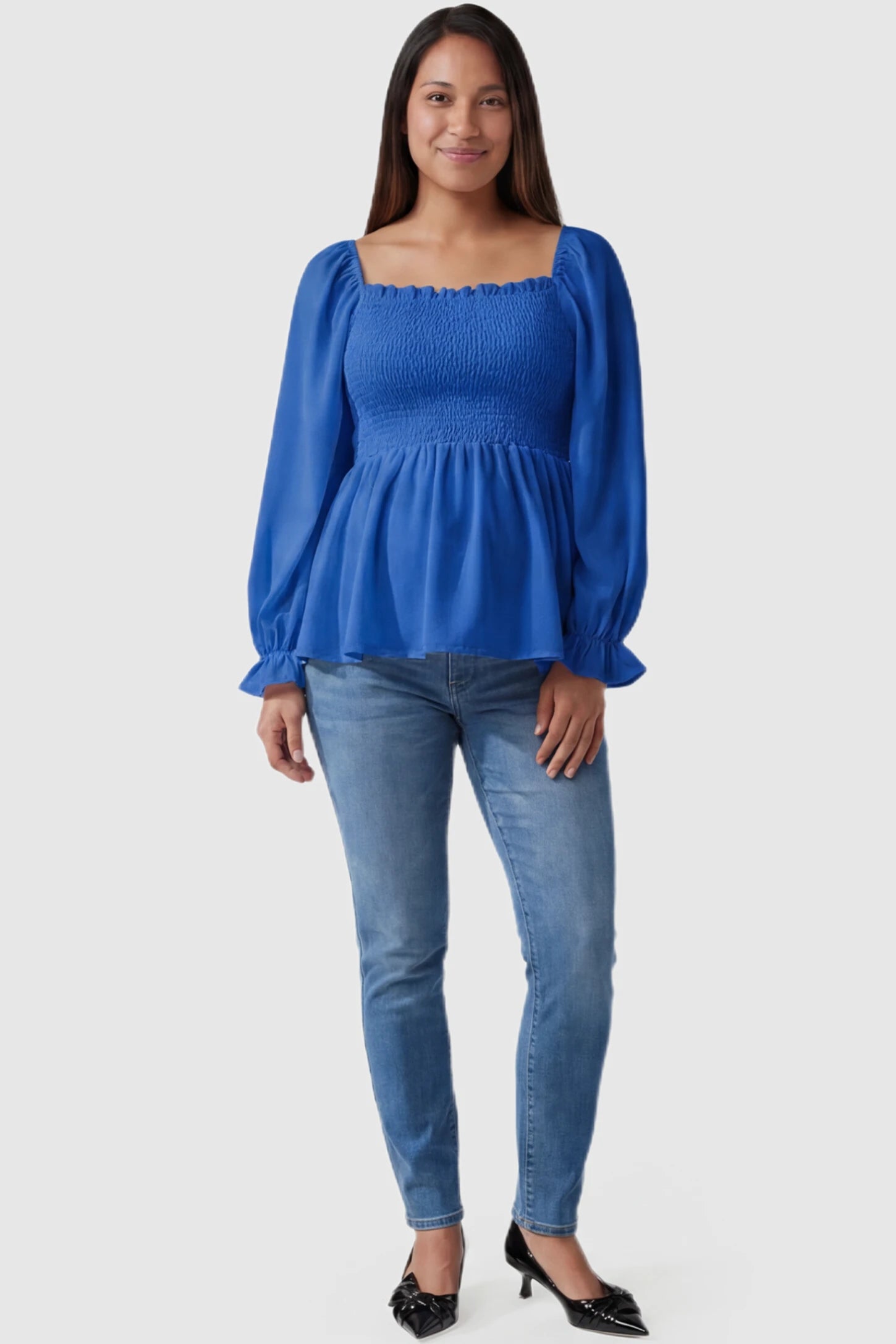 Smocked Convertible Neckline Bishop Sleeve Maternity Top Smocked Convertible Neckline Bishop Sleeve Maternity Top in Blue featuring a smocked bodice on a pregnant model full body view.