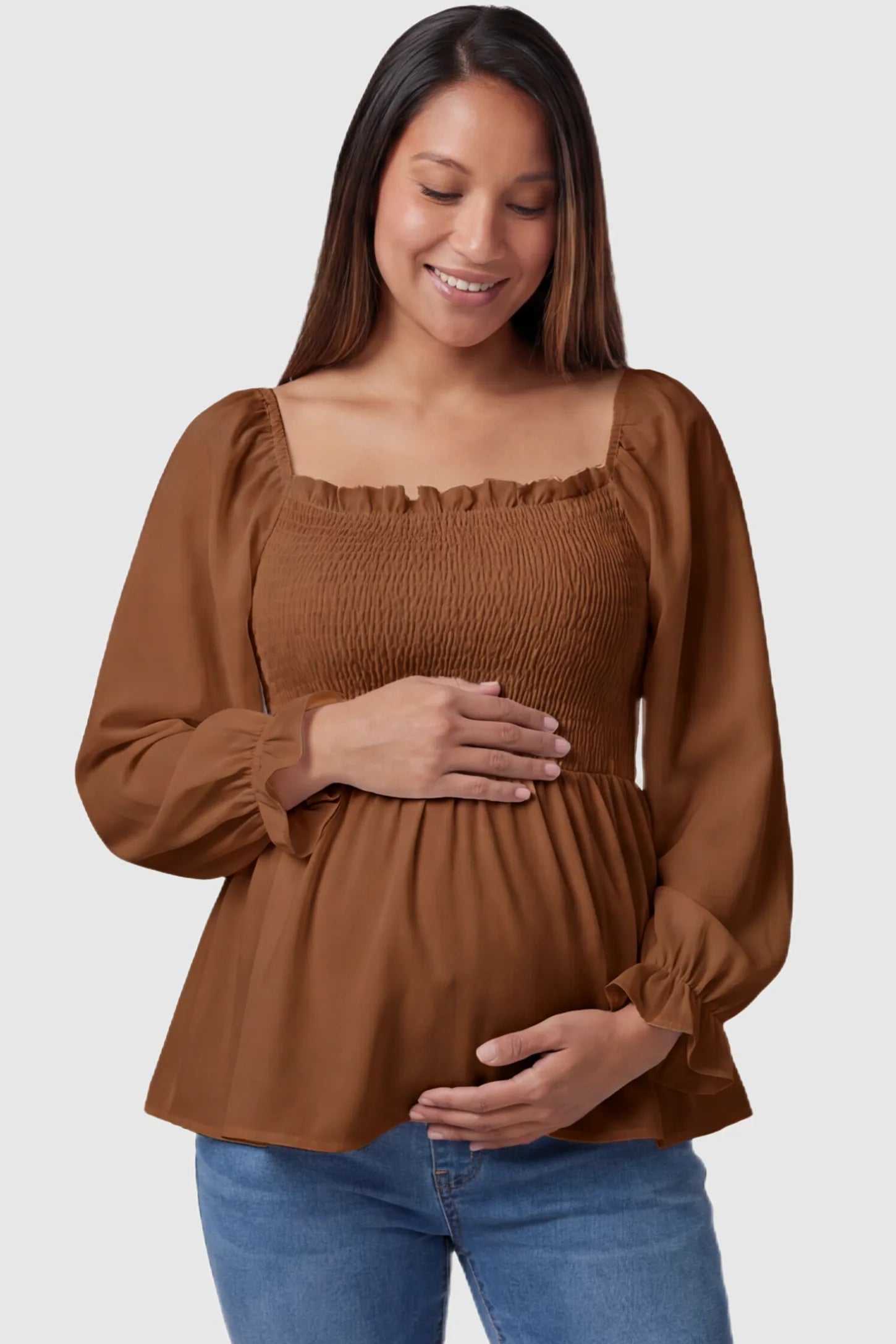 Smocked Convertible Neckline Bishop Sleeve Maternity Top Smocked Convertible Neckline Bishop Sleeve Maternity Top in Coffee featuring a smocked bodice on a pregnant model front view.