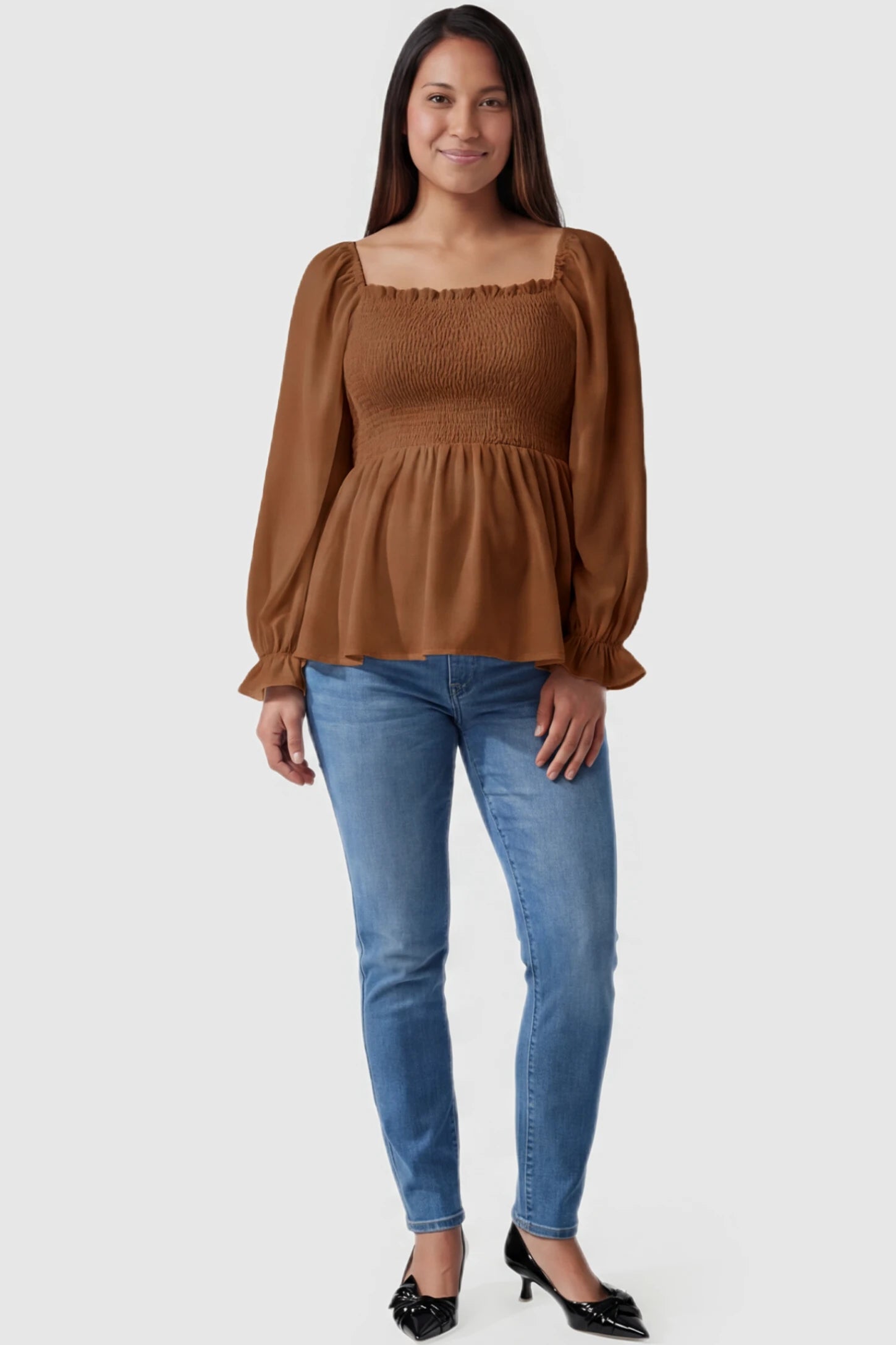 Smocked Convertible Neckline Bishop Sleeve Maternity Top Smocked Convertible Neckline Bishop Sleeve Maternity Top in Coffee featuring a smocked bodice on a pregnant model full body view.