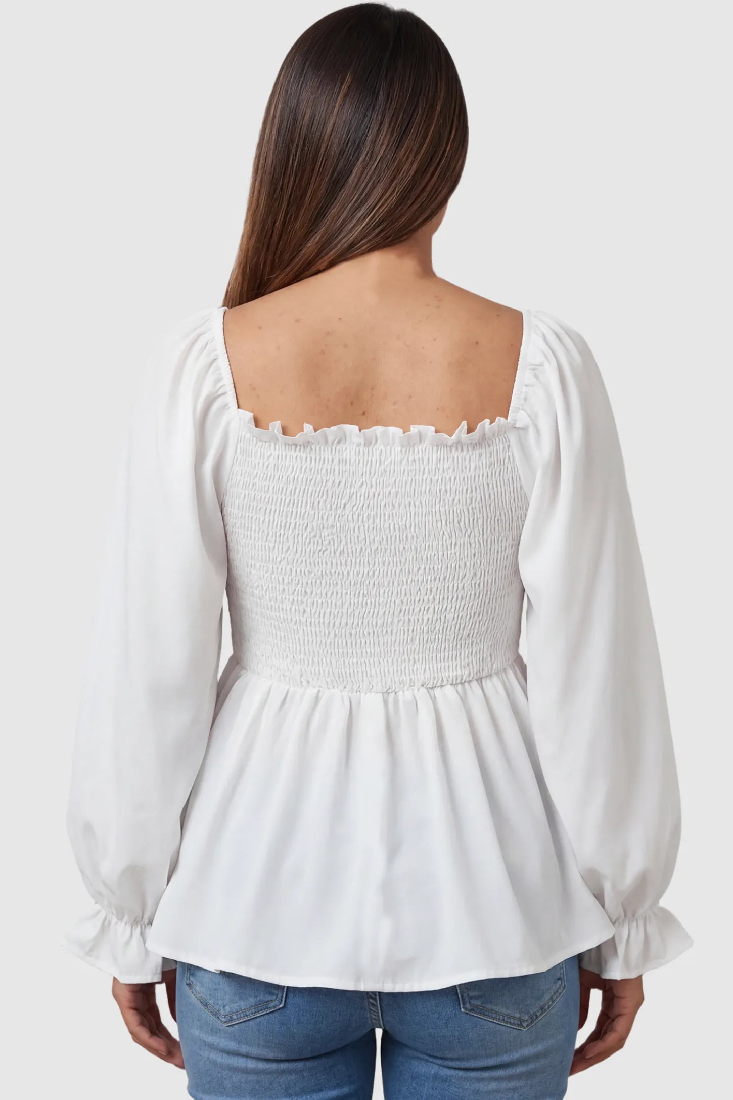 Smocked Convertible Neckline Bishop Sleeve Maternity Top Smocked Convertible Neckline Bishop Sleeve Maternity Top in White featuring a ruffled square back on a pregnant model back view.