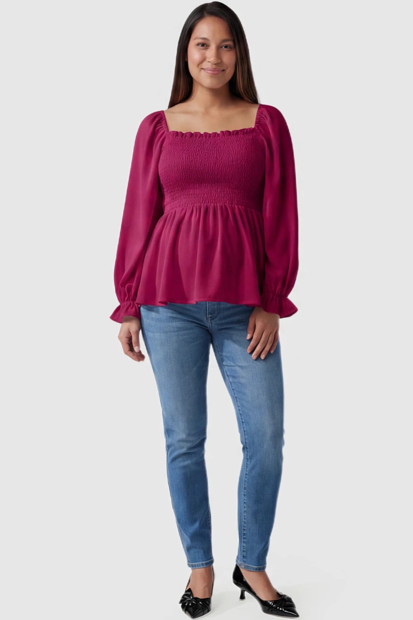 Smocked Convertible Neckline Bishop Sleeve Maternity Top Smocked Convertible Neckline Bishop Sleeve Maternity Top in Wine Red featuring a smocked bodice on a pregnant model full body view.