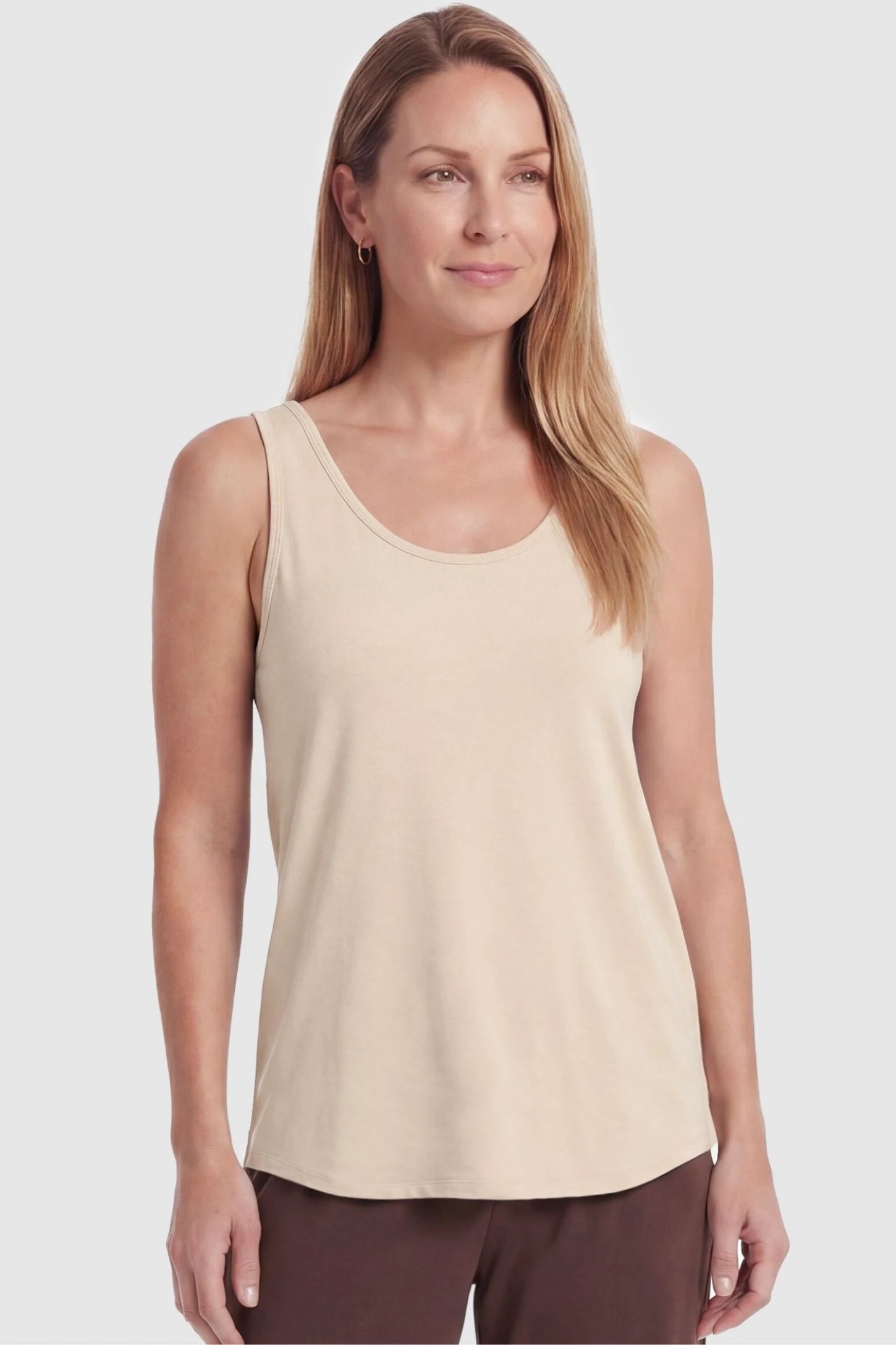 Soft Knit Sleeveless Maternity Tank Top Soft Knit Sleeveless Maternity Tank Top in Beige featuring a relaxed drape on a postpartum model, front view.