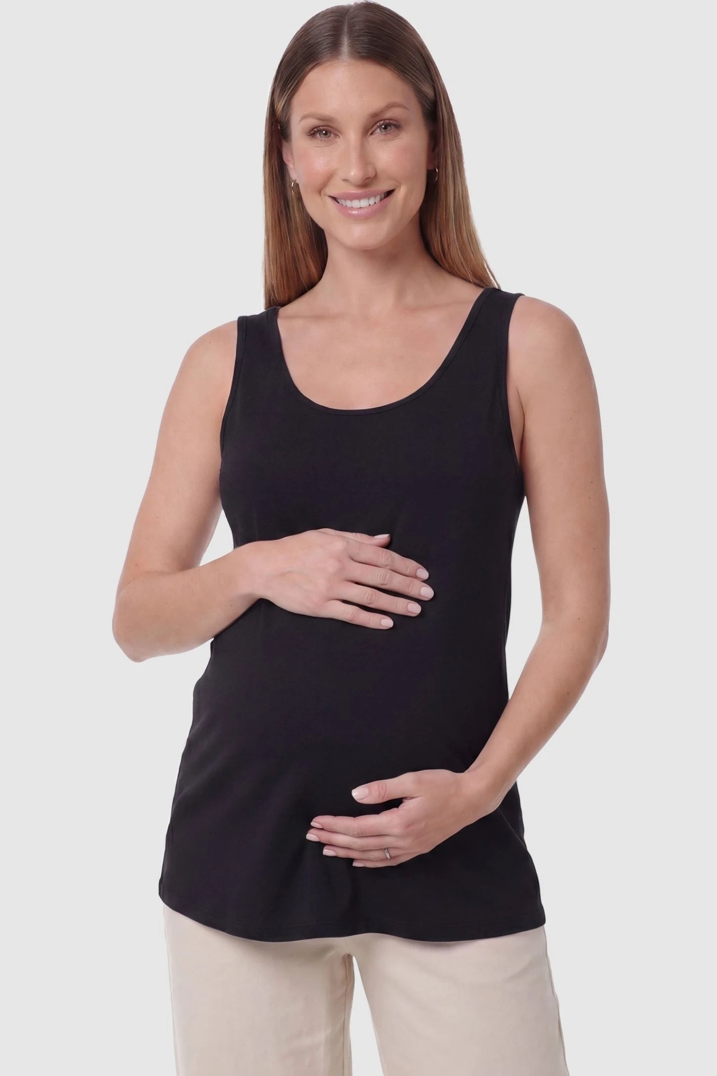 Soft Knit Sleeveless Maternity Tank Top Soft Knit Sleeveless Maternity Tank Top in Black featuring a scoop neckline on a pregnant model, front view.