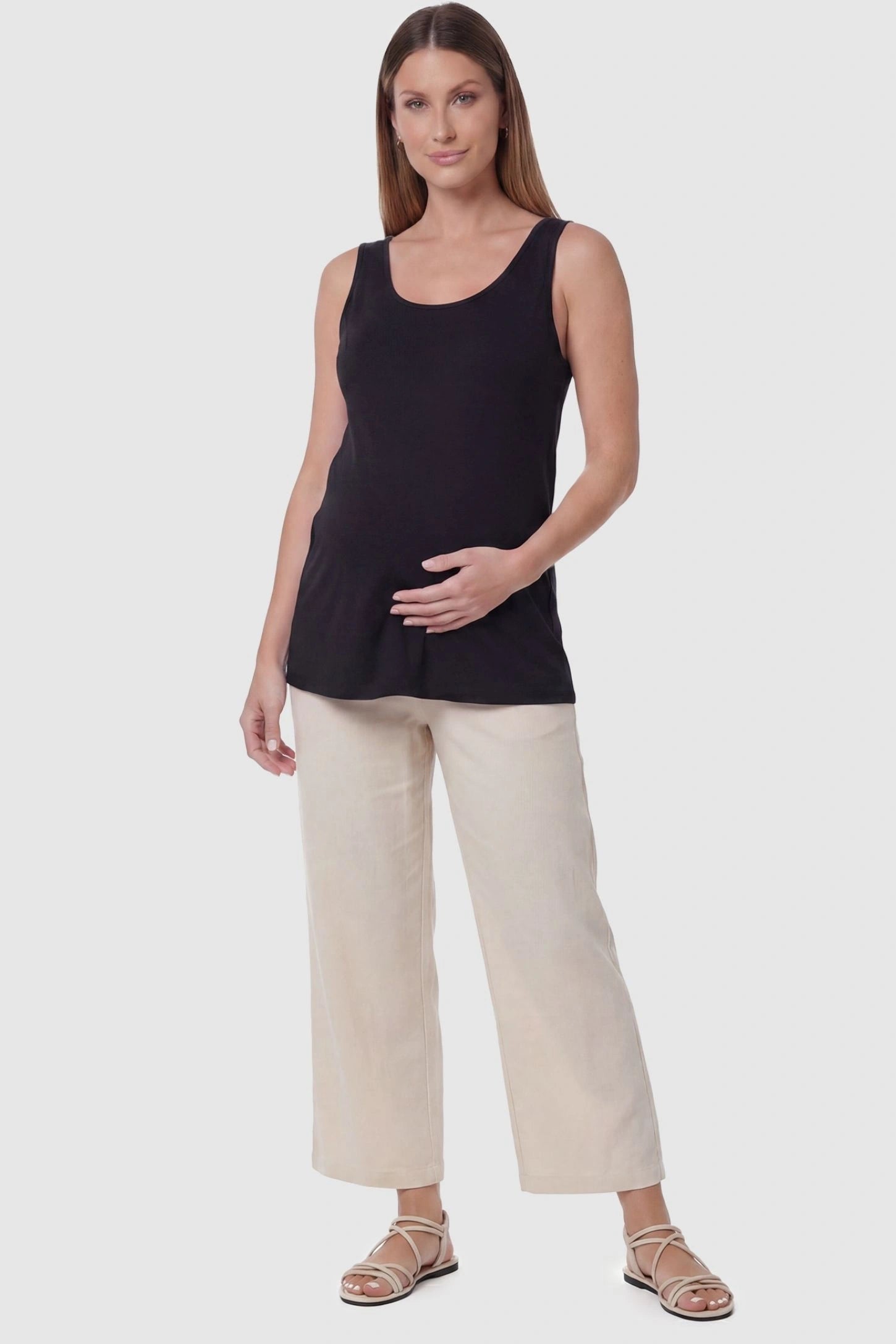 Soft Knit Sleeveless Maternity Tank Top Soft Knit Sleeveless Maternity Tank Top in Black featuring a scoop neckline on a pregnant model, front view.