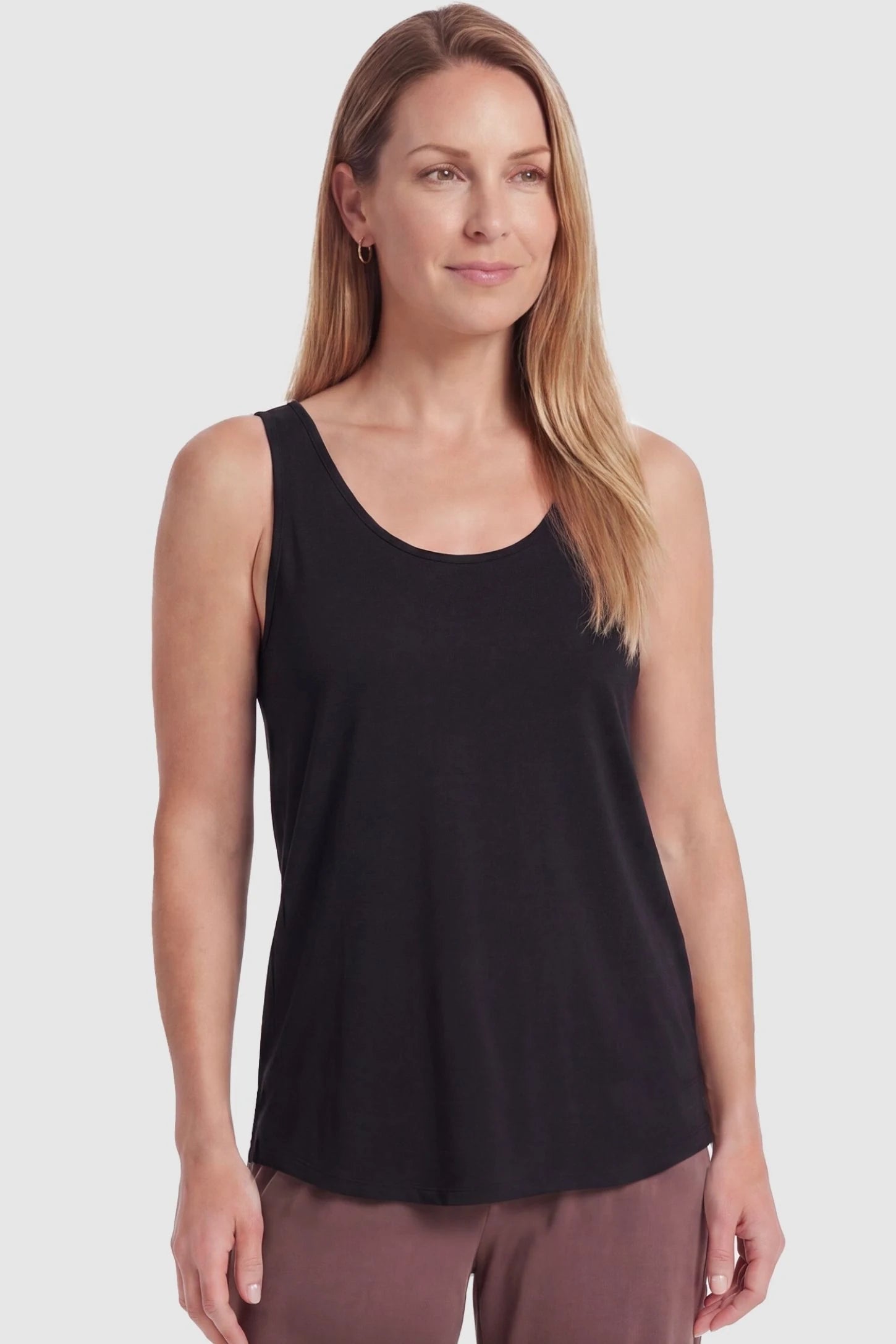 Soft Knit Sleeveless Maternity Tank Top Soft Knit Sleeveless Maternity Tank Top in Black featuring a relaxed drape on a postpartum model, front view.