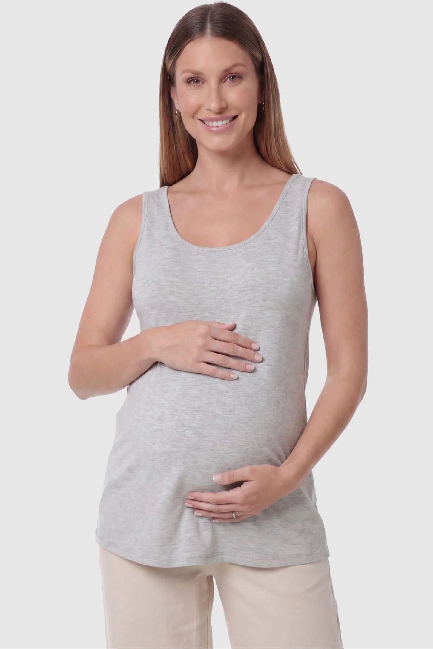 Soft Knit Sleeveless Maternity Tank Top Soft Knit Sleeveless Maternity Tank Top in Gray featuring a scoop neckline on a pregnant model, front view.