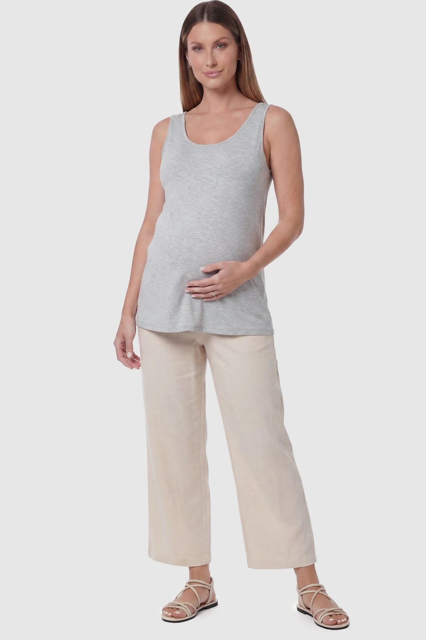 Soft Knit Sleeveless Maternity Tank Top Soft Knit Sleeveless Maternity Tank Top in Gray featuring a scoop neckline on a pregnant model, front view.