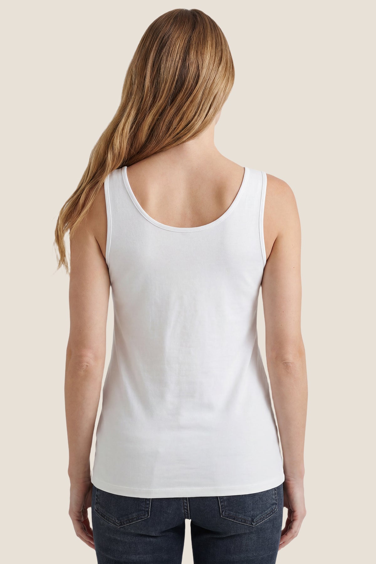 Soft Knit Sleeveless Maternity Tank Top Soft Knit Sleeveless Maternity Tank Top in White featuring a straight hemline on a pregnant model, back view.