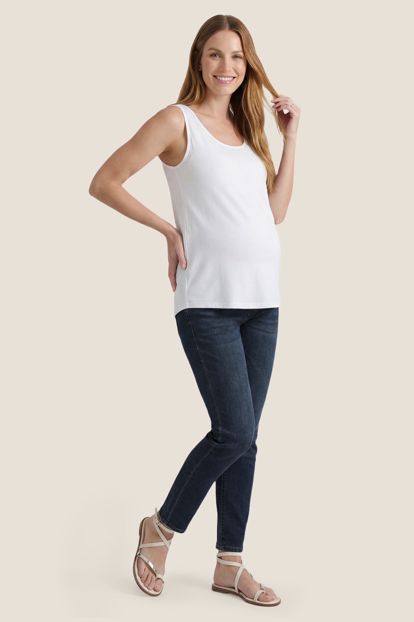 Soft Knit Sleeveless Maternity Tank Top Soft Knit Sleeveless Maternity Tank Top in White featuring a wide tank strap design on a pregnant model, full-body view.