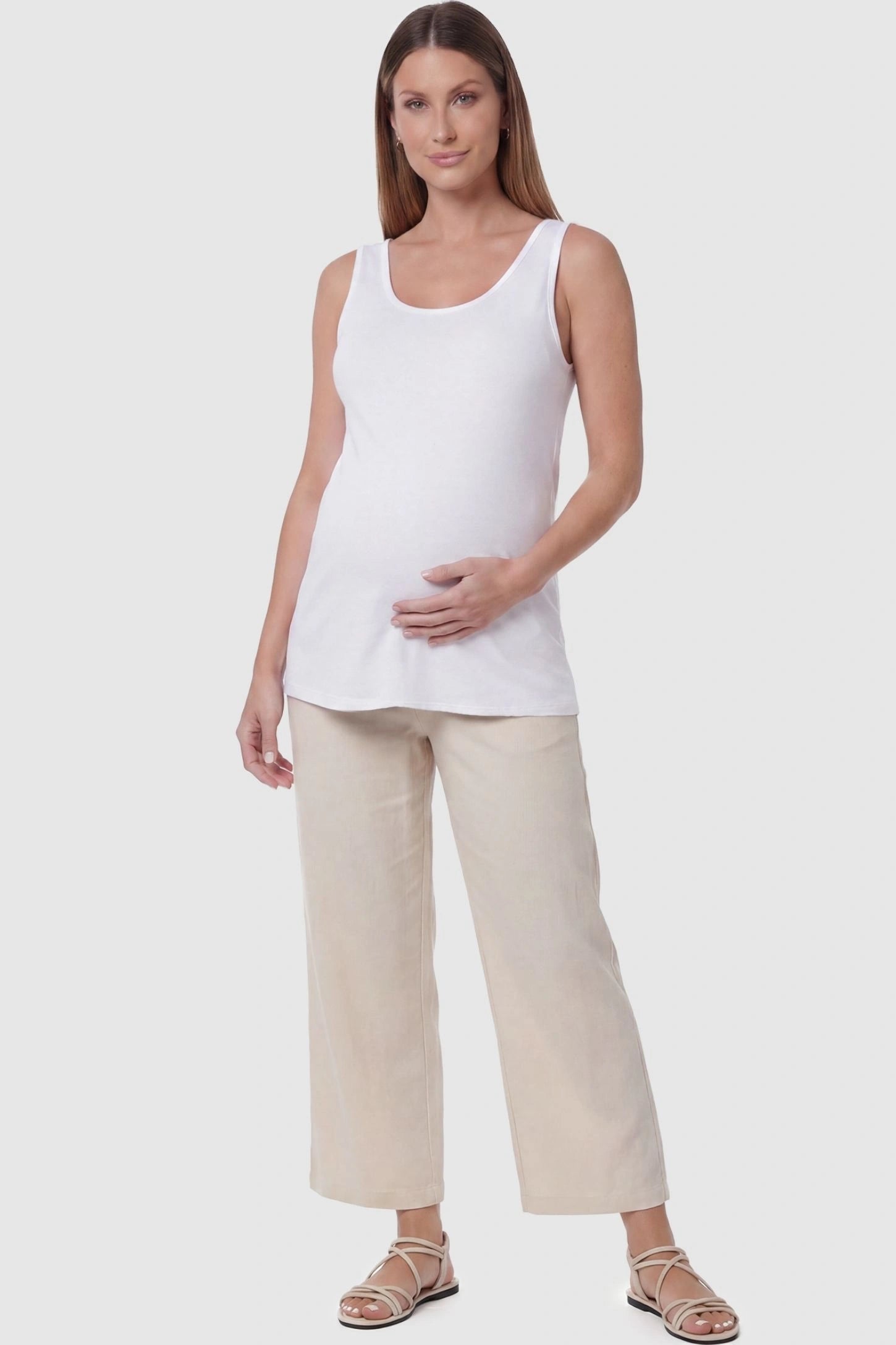 Soft Knit Sleeveless Maternity Tank Top Soft Knit Sleeveless Maternity Tank Top in White featuring a wide tank strap design on a pregnant model, back view.