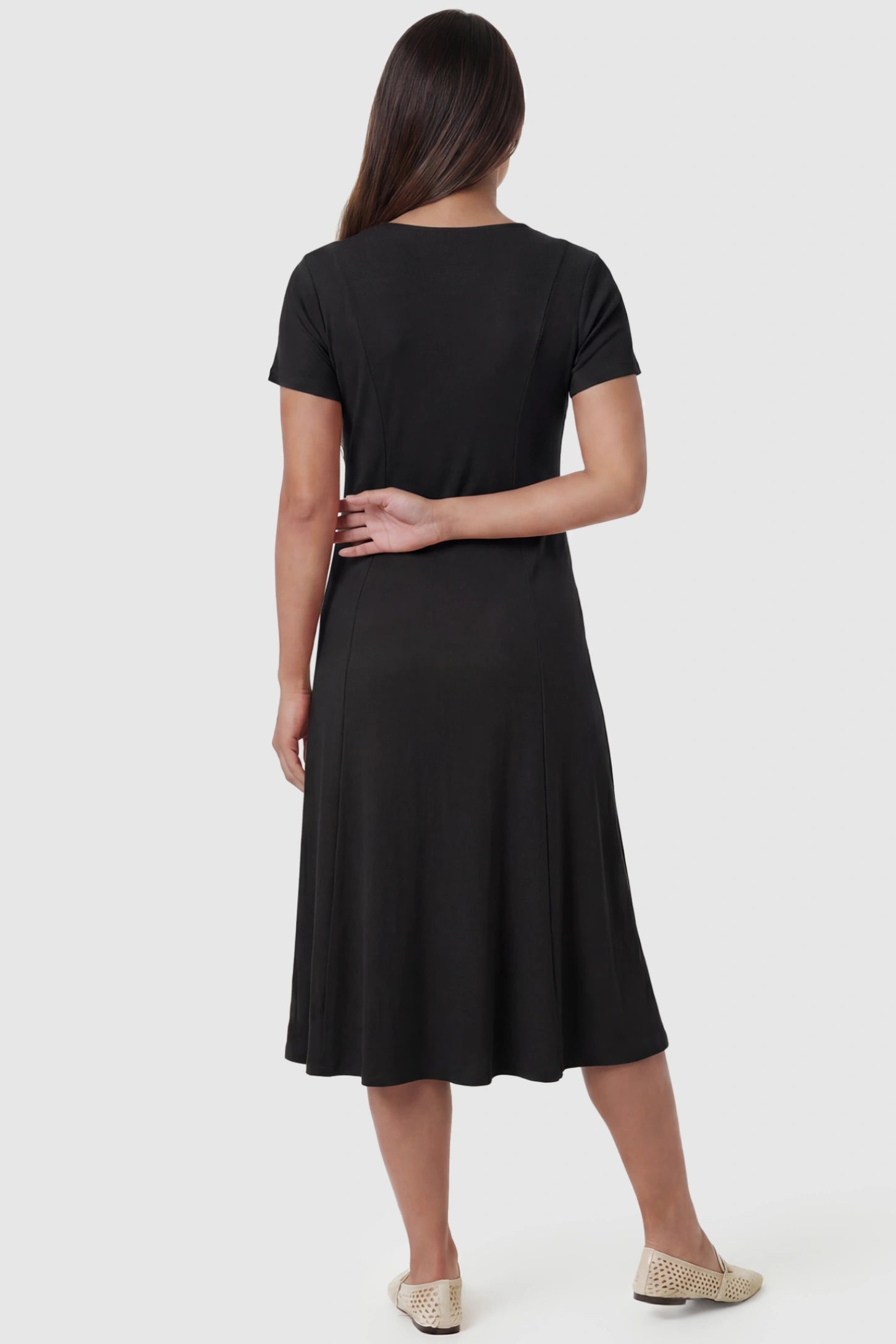 Soft Knit Stretch Short Sleeve Maternity Midi Dress Soft Knit Stretch Short Sleeve Maternity Midi Dress in Black featuring high stretch knit on a pregnant model, back view.