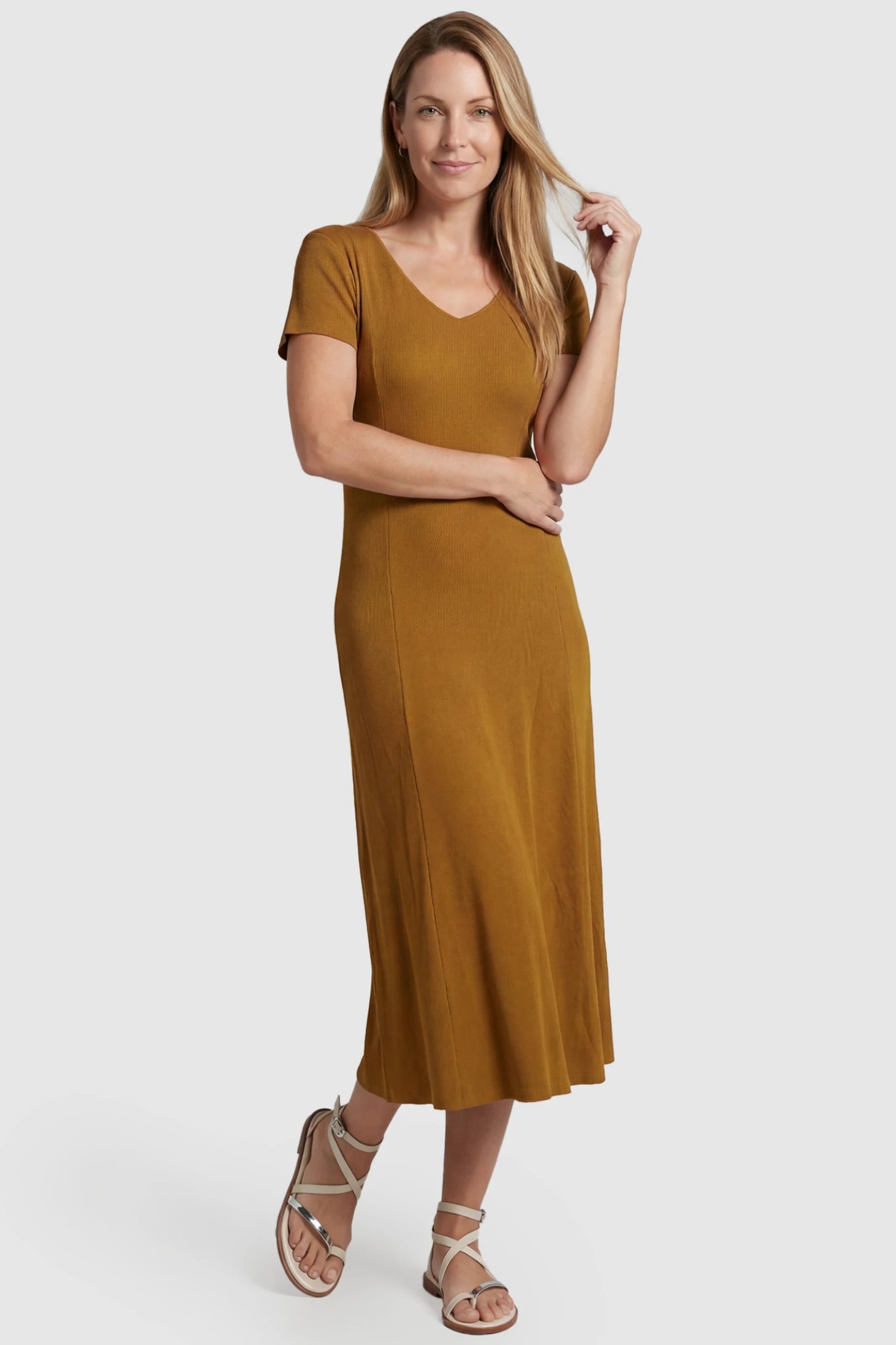 Soft Knit Stretch Short Sleeve Maternity Midi Dress Soft Knit Stretch Short Sleeve Maternity Midi Dress in Camel featuring a flattering v-neck and high stretch knit on a postpartum model, front view.