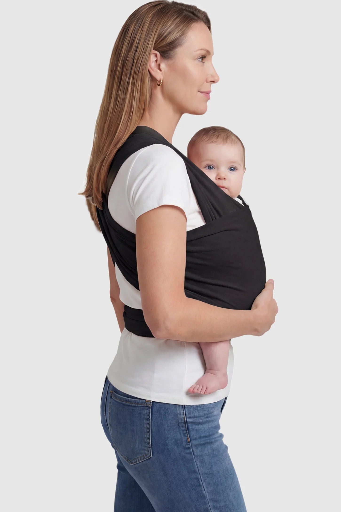 Soft Stretch Adjustable Baby Wrap Carrier Soft Stretch Adjustable Baby Wrap Carrier in Black featuring a polyester blend holding a baby.
