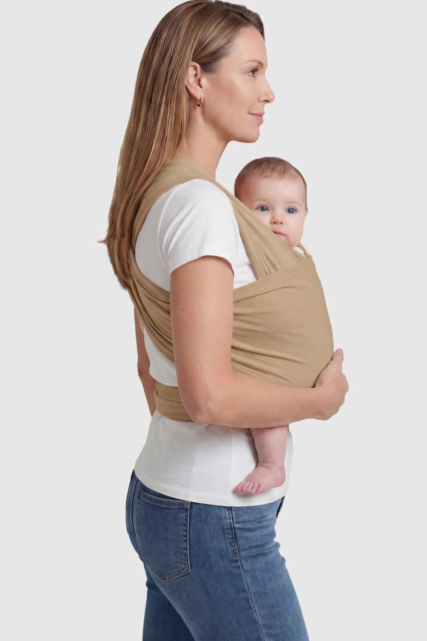 Soft Stretch Adjustable Baby Wrap Carrier Soft Stretch Adjustable Baby Wrap Carrier in Coffee featuring a polyester blend holding a baby.