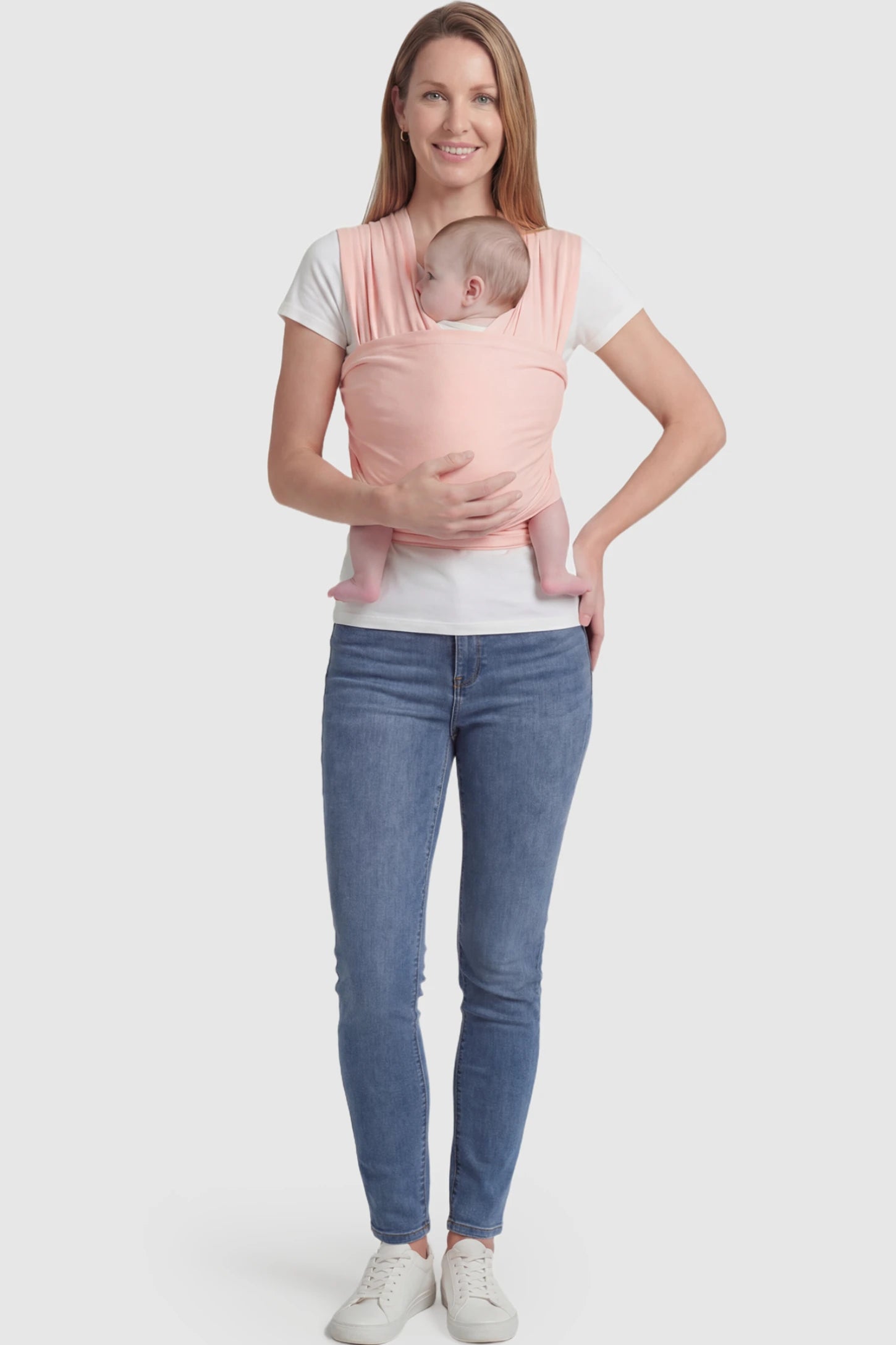 Soft Stretch Adjustable Baby Wrap Carrier Soft Stretch Adjustable Baby Wrap Carrier in Lotus Root Pink featuring a polyester blend holding a baby.