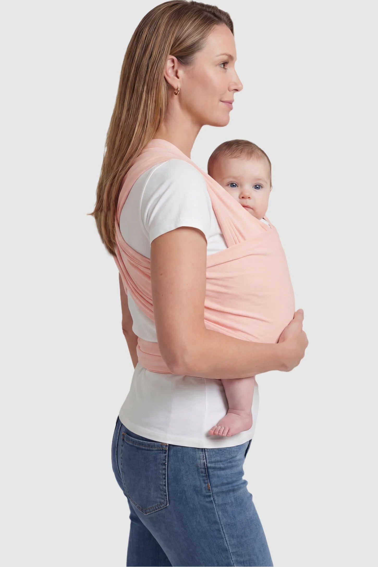 Soft Stretch Adjustable Baby Wrap Carrier in Lotus Root Pink featuring a polyester blend holding a baby.